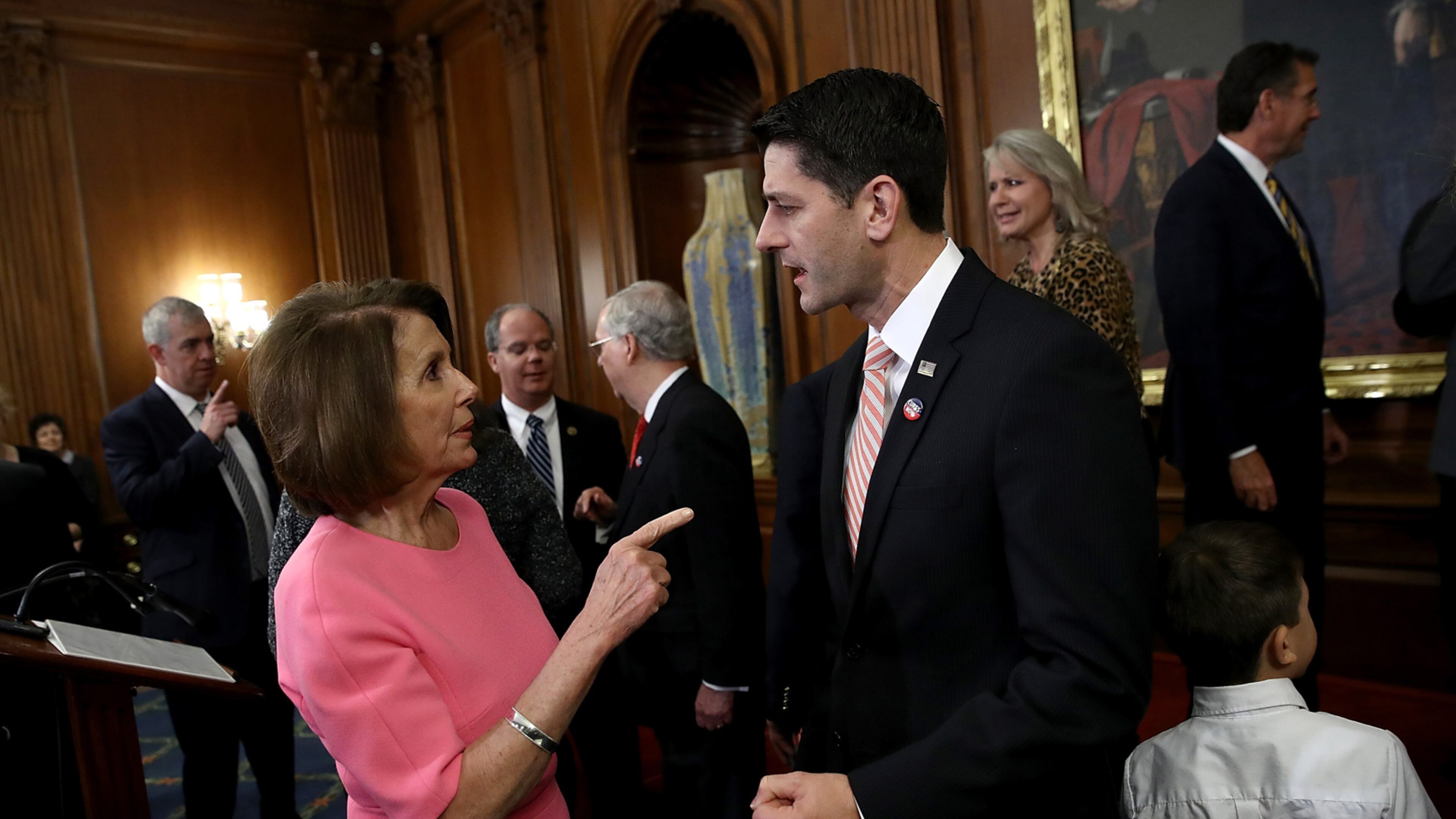 WASHINGTON, DC - DECEMBER 08: U.S. Speaker of the House Paul Ryan (R) (R-WI) speaks with House Minority Leader Rep. Nancy Pelosi (D-CA) following an event marking the passage of the 21st Century Cures Act at the U.S. Capitol December 8, 2016 in Washington, DC. The bill, passed with strong bipartisan support, provides funding for cancer research, the fight against the epidemic of opioid abuse, mental health treatment, aids the Food and Drug Administration in expediting drug approvals and pushes for better use of technology in medicine. (Photo by Win McNamee/Getty Images) *** BESTPIX ***