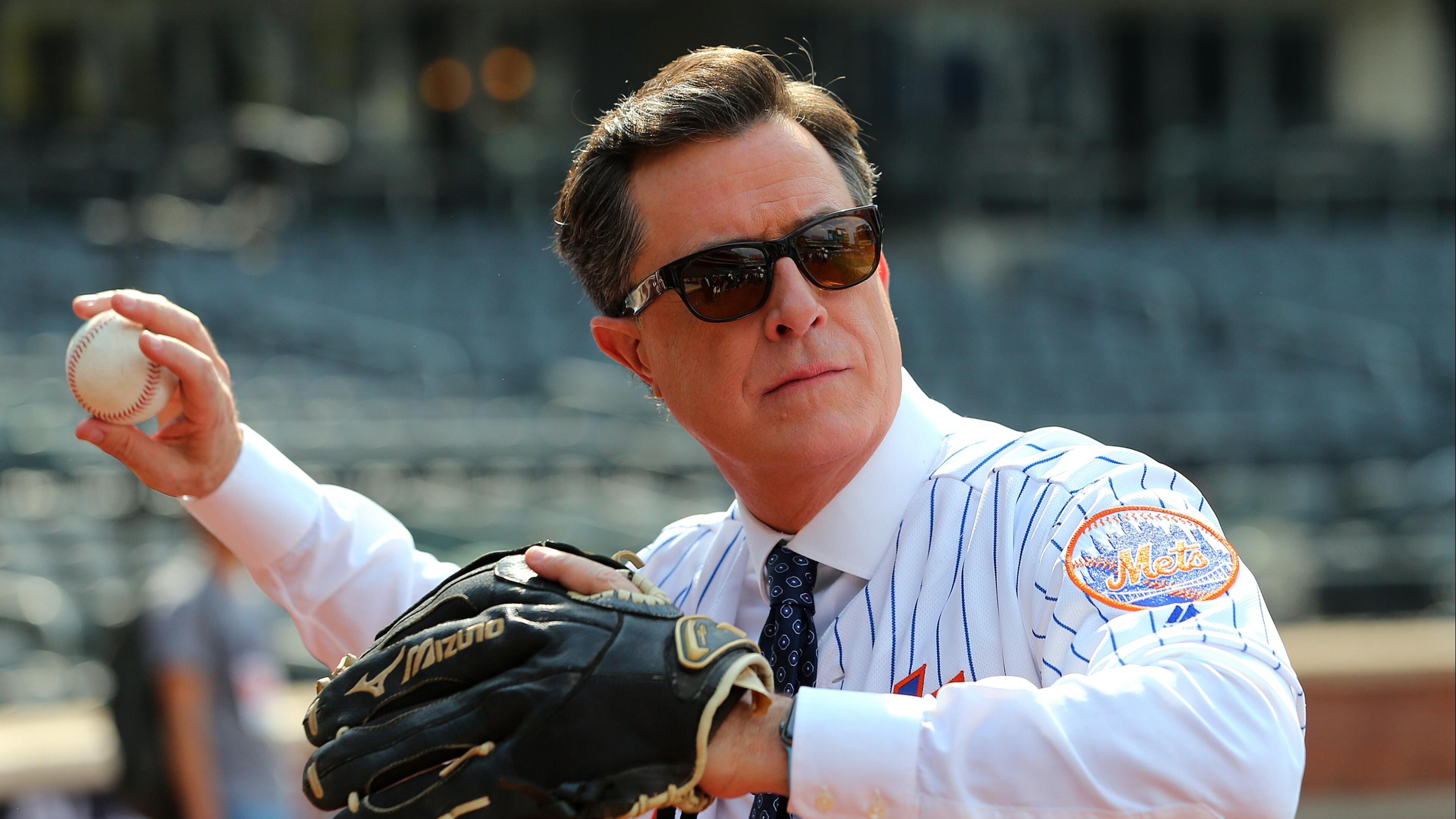 Comedian and talk show host Stephen Colbert plays catch before a game between the New York Yankees and New York Mets at Citi Field on June 8, 2018 in the Flushing neighborhood of the Queens borough of New York City. (Photo by Rich Schultz/Getty Images)