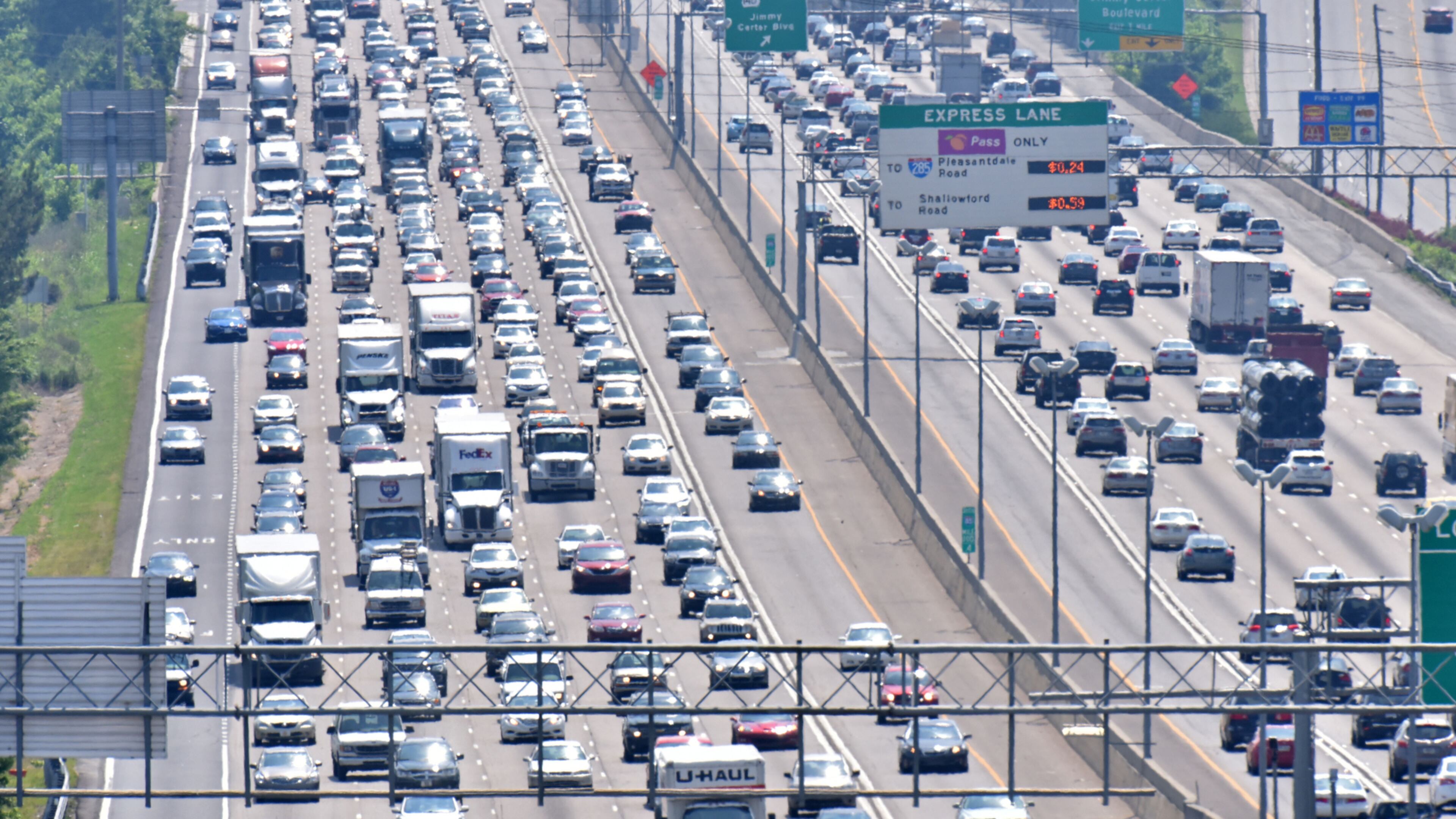 HEADED OUT OF TOWN--May 27, 2016 Norcross - Afternoon rush hour traffic on was backed up for miles in both directions on I-85 in Gwinnett County on Friday, May 27, 2016. HYOSUB SHIN / HSHIN@AJC.COM