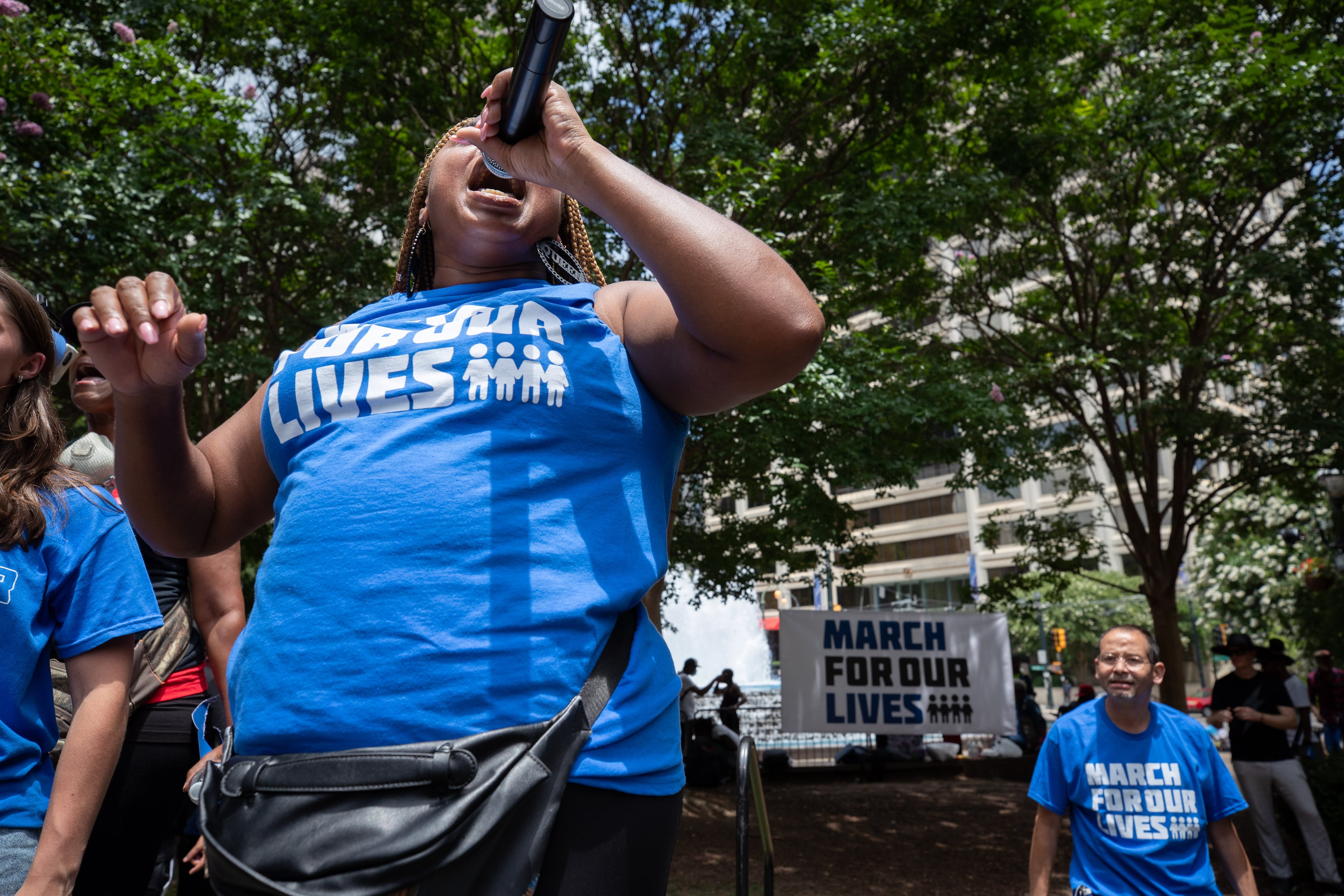 Organizer Porchse Miller speaks to the crowd during a March for Our Lives rally at Woodruff Park on Saturday, June 11, 2022. (Steve Schaefer / steve.schaefer@ajc.com)