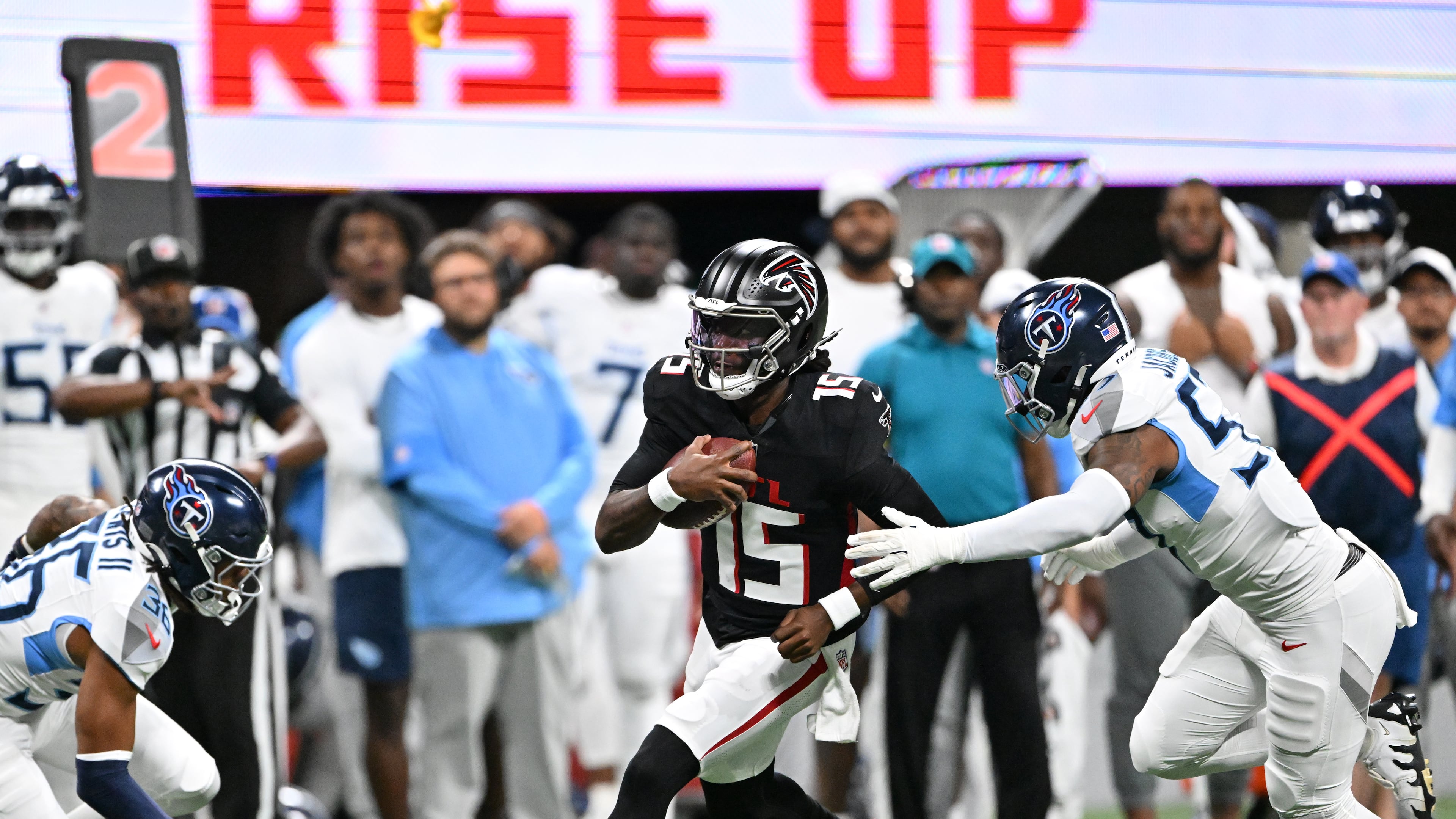 Falcons quarterback Emory Jones (center), here running the ball against the Titans on Friday, Aug. 15, 2025, was injured later in the game. Atlanta cut Jones on Monday. (Hyosub Shin/AJC)