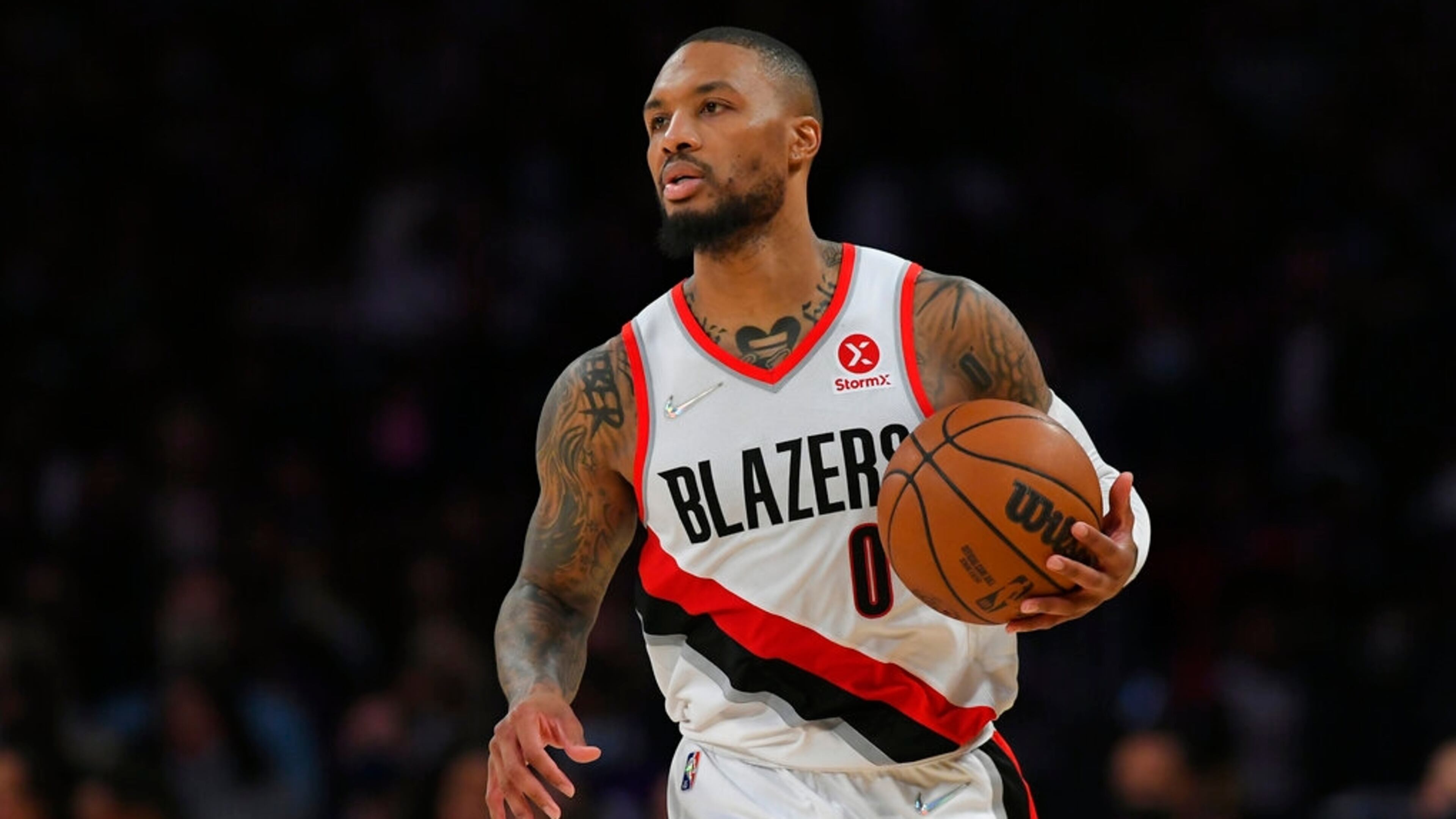 Portland Trail Blazers guard Damian Lillard (0) seen playing the Los Angeles Lakers in an NBA basketball game, Friday Dec. 31, 2021, in Los Angeles. (AP Photo/John McCoy)