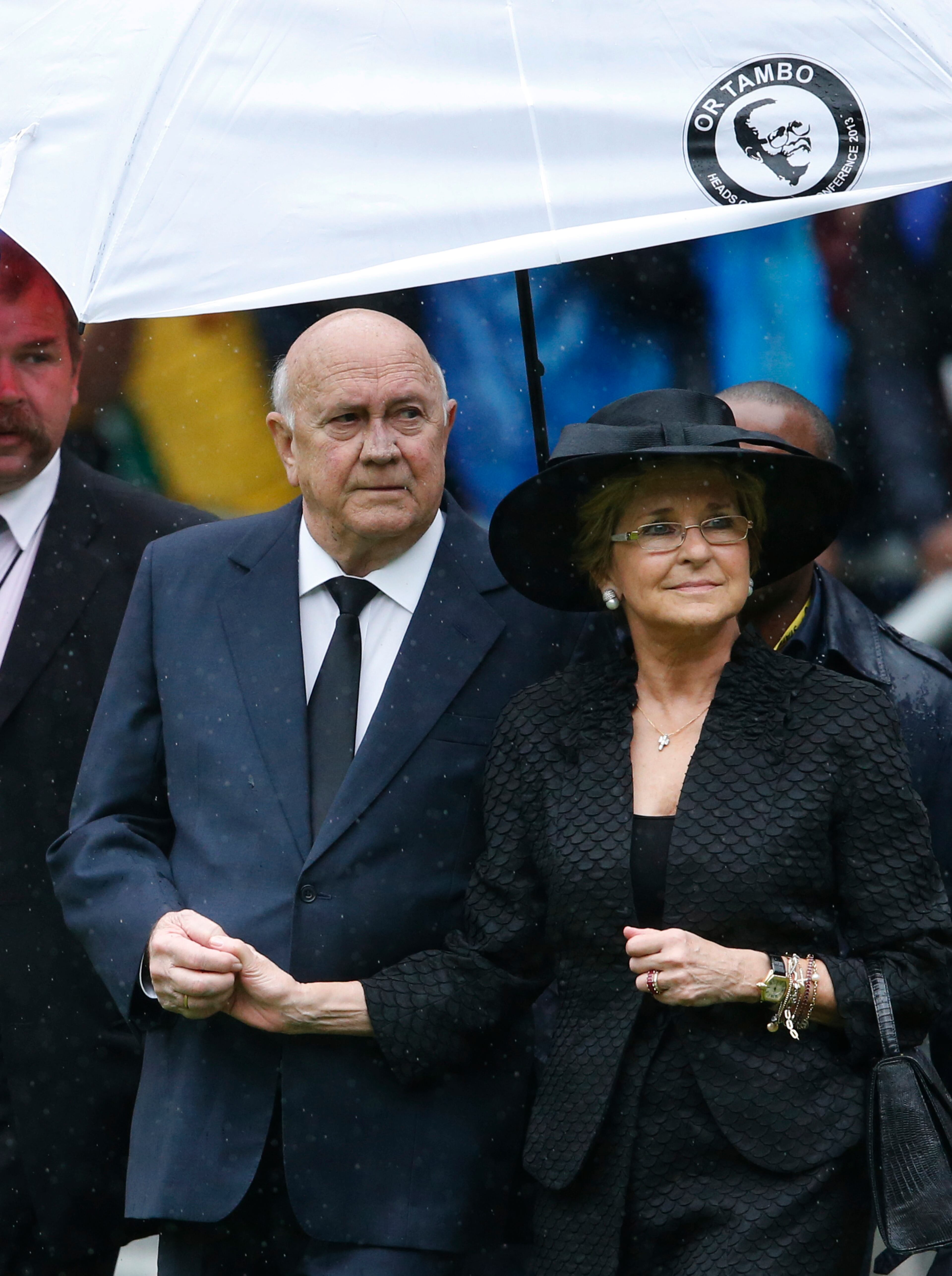 South Africa's last apartheid-era president, F.W. de Klerk arrives with his wife for the memorial service for former South African president Nelson Mandela at the FNB Stadium in Soweto near Johannesburg, Tuesday, Dec. 10, 2013.