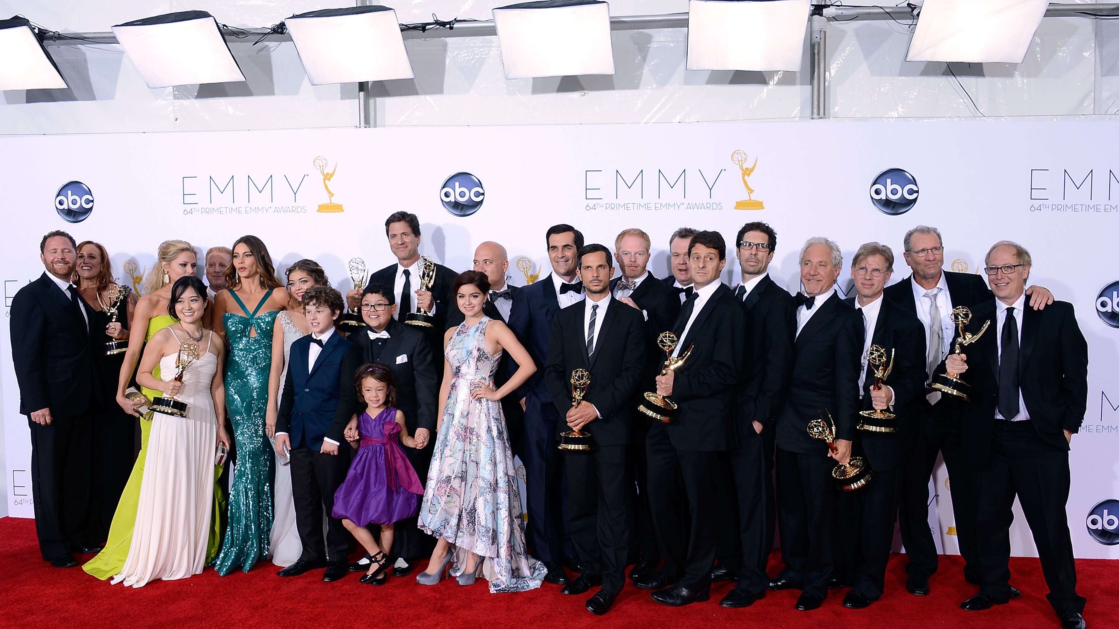 LOS ANGELES, CA - SEPTEMBER 23: Show creator Steven Levitan (C) with cast and crew members, winners of the Outstanding Comedy Series Award for 'Modern Family' pose in the press room during the 64th Annual Primetime Emmy Awards at Nokia Theatre L.A. Live on September 23, 2012 in Los Angeles, California. Actor Jackson Millarker, not pictured, will be the first child actor who is transgender cast in a TV show. (Photo by Kevork Djansezian/Getty Images)