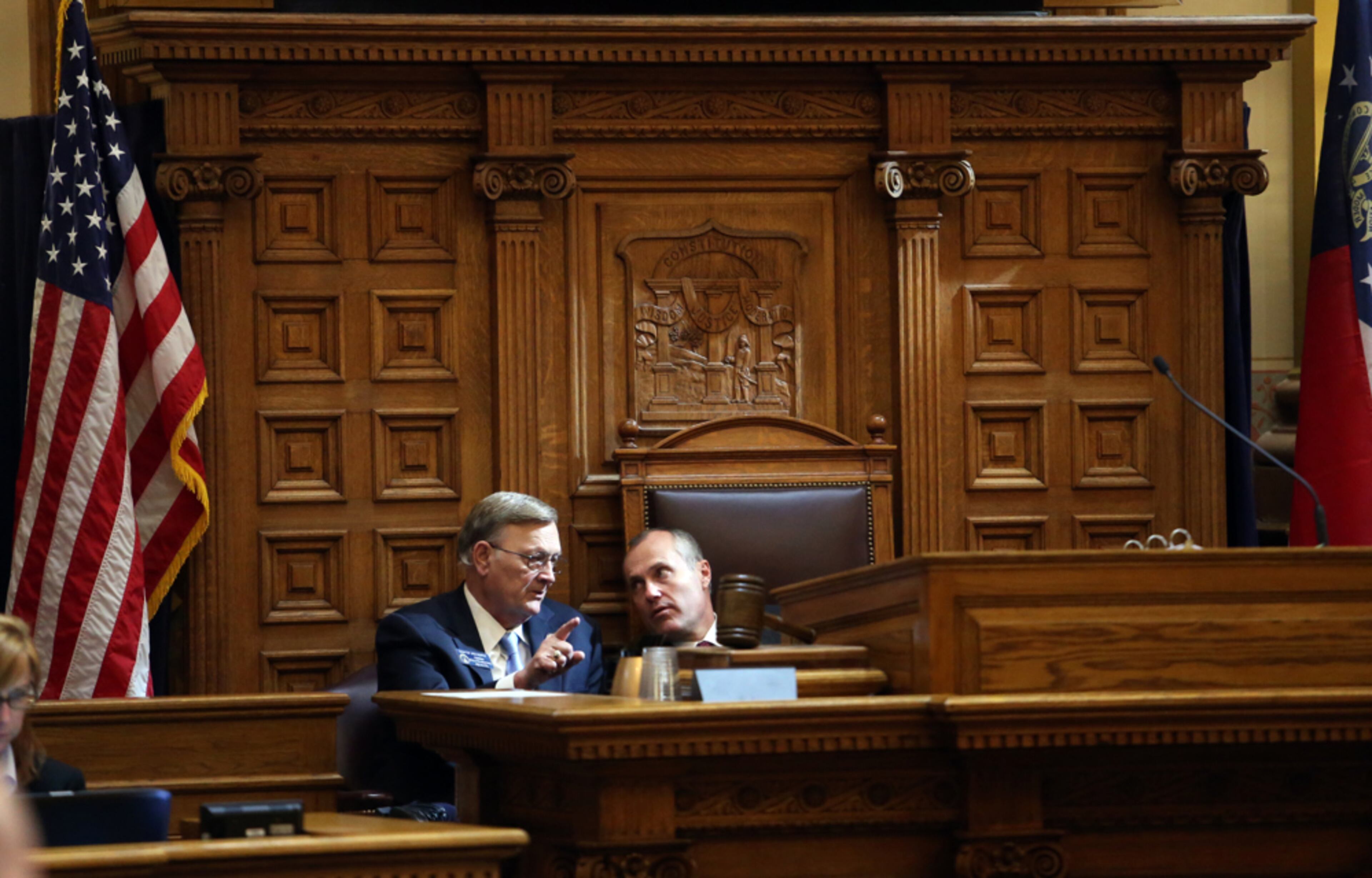 March 4, 2013 - Atlanta, Ga: Sen. Jack Murphy, R-Cumming, left, talks with Lt. Gov. Casey Cagle during the debate on Senate Bill 101 in the Senate Chambers Monday afternoon in Atlanta, Ga., March 4, 2013. Getz said, "This is a simple photograph, but what's so nice about this scene is the light streaming through the window. After covering the Senate for two years, you learn when the light is the most dramatic. On a sunny day, this only happens about 10 minutes per day." JASON GETZ / JGETZ@AJC.COM
