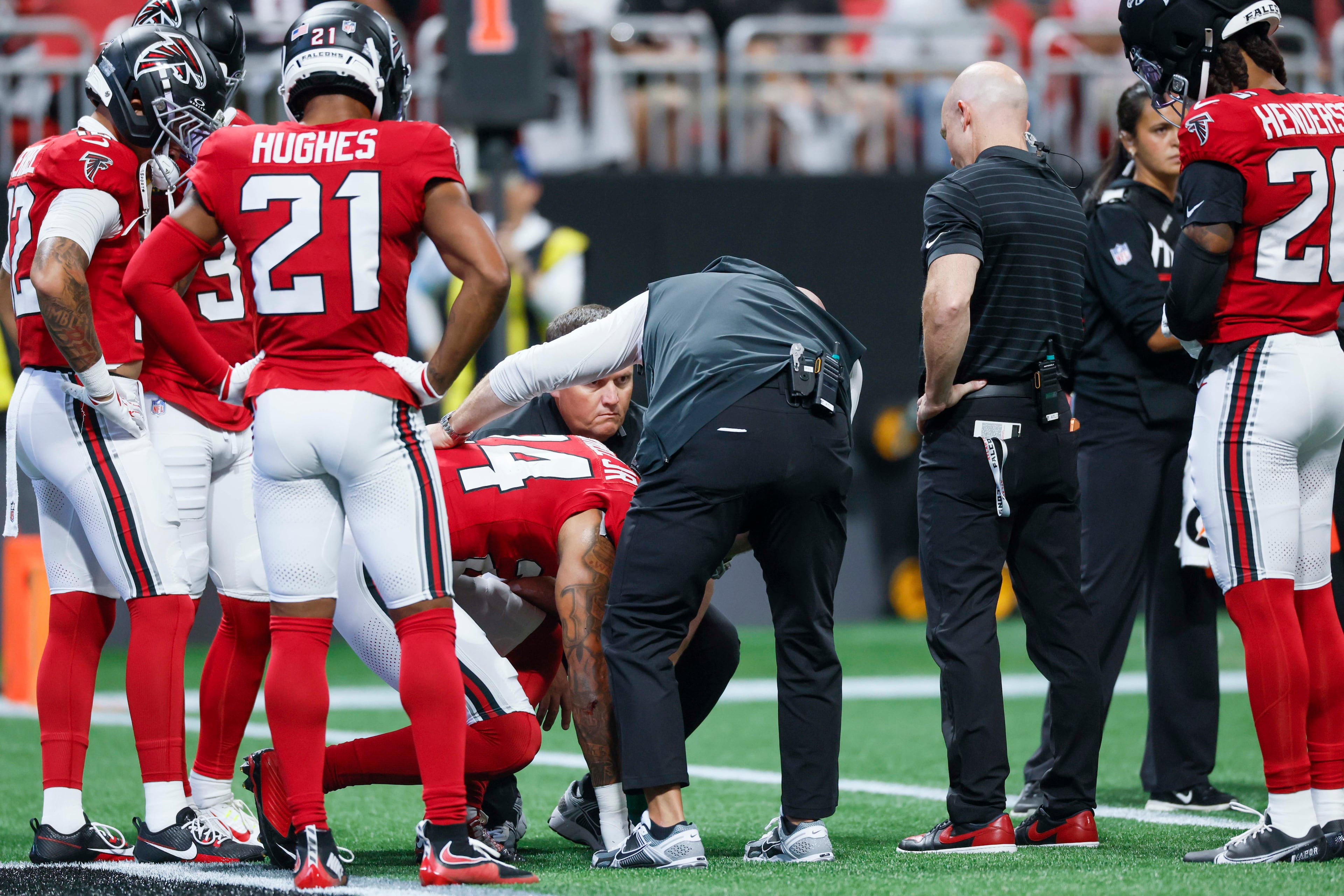Atlanta Falcons cornerback A.J. Terrell Jr. (24) receives assistance from the medical staff after an injury timeout in the first half of an NFL game against the Carolina Panthers at Mercedes-Benz Stadium in Atlanta on Sunday, September 20, 2026. (Miguel Martinez/AJC)