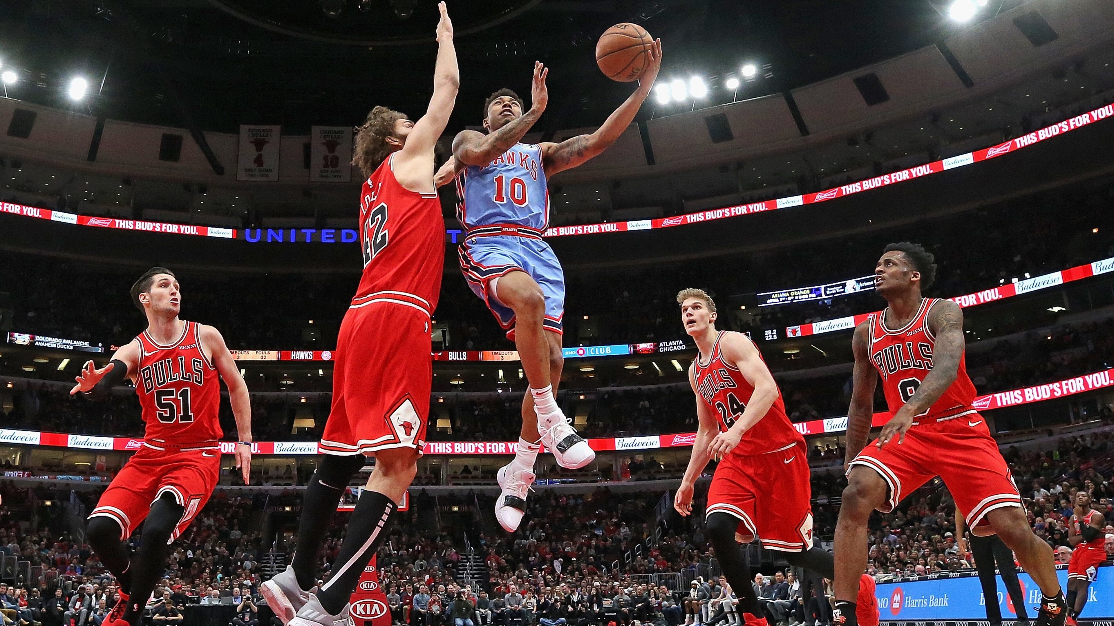Jaylen Adams #10 of the Atlanta Hawks drives against (L-R) Ryan Arcidiacono #51, Robin Lopez #42, Lauri Markkanen #24 and Antonio Blakeney #9 of the Chicago Bulls at the United Center on March 03, 2019 in Chicago, Illinois. The Hawks defeated the Bulls 123-118.