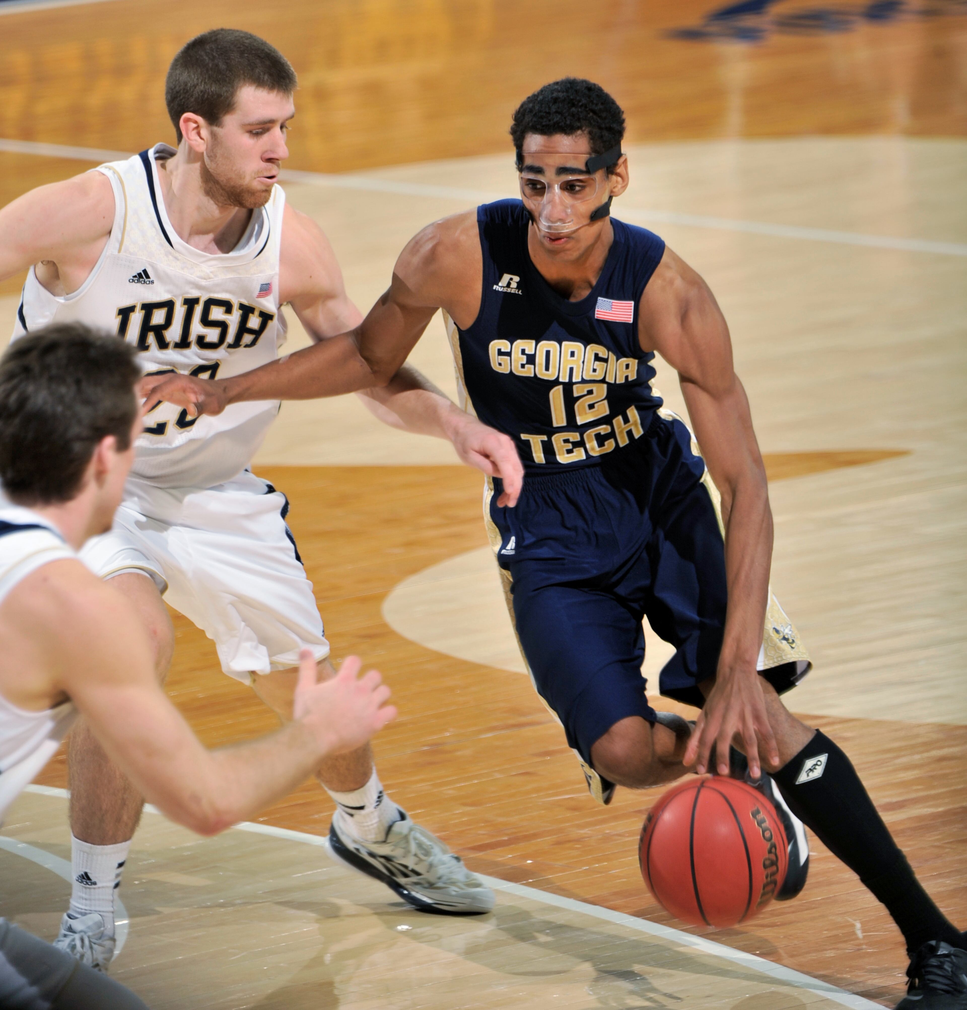 Georgia Tech guard Quinton Stephens drives the lane as Notre Dame guard Austin Burgett defends during the first half of an NCAA college basketball game, Wednesday, Feb. 26, 2014 in South Bend, Ind. (AP Photo/Joe Raymond)