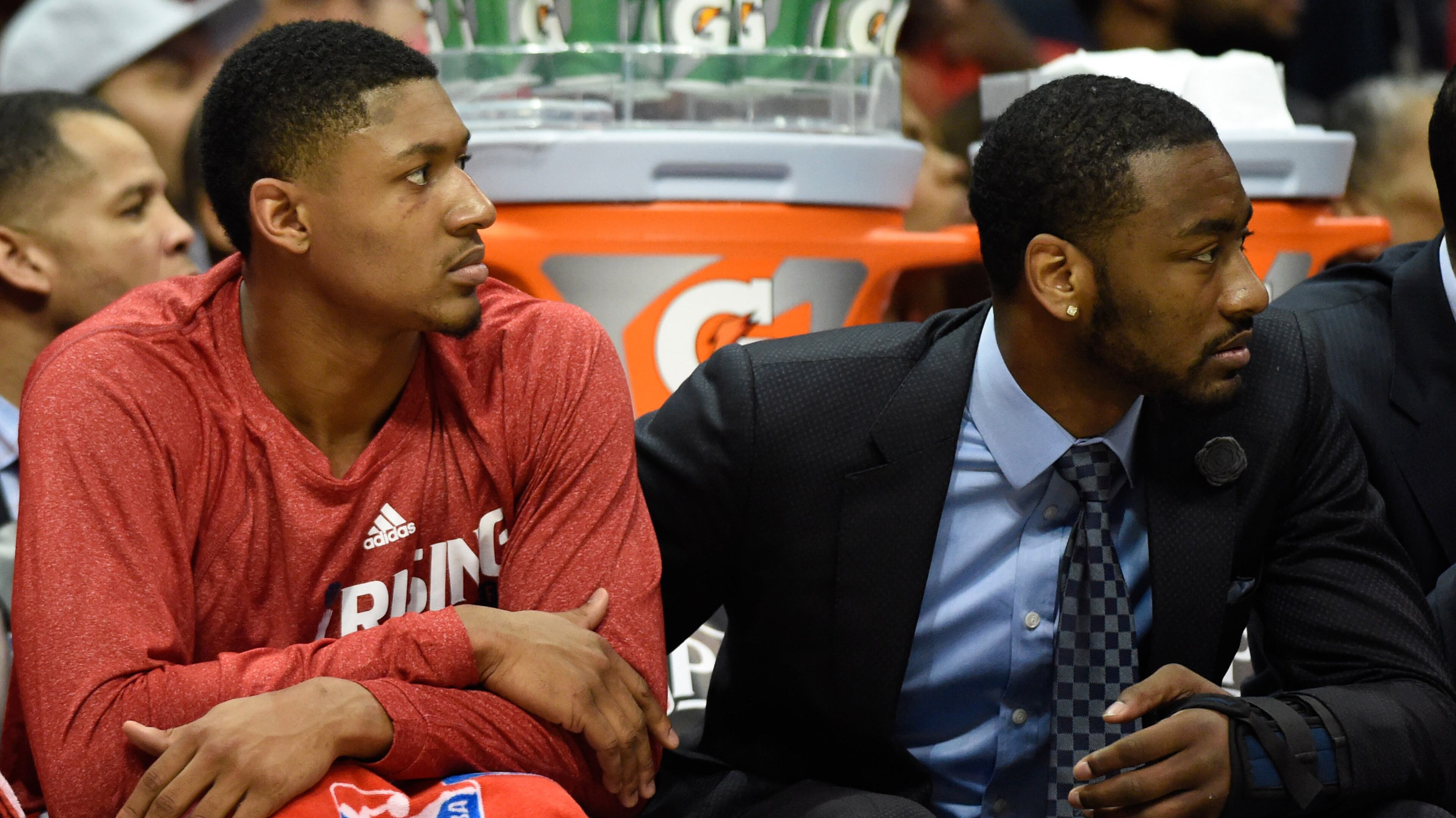 Washington's John Wall, here with teammate Bradley Beal, watches Game 2 with a soft cast on his left hand Tuesday night at Philips Arena. (Dale Zanine, USA Today)