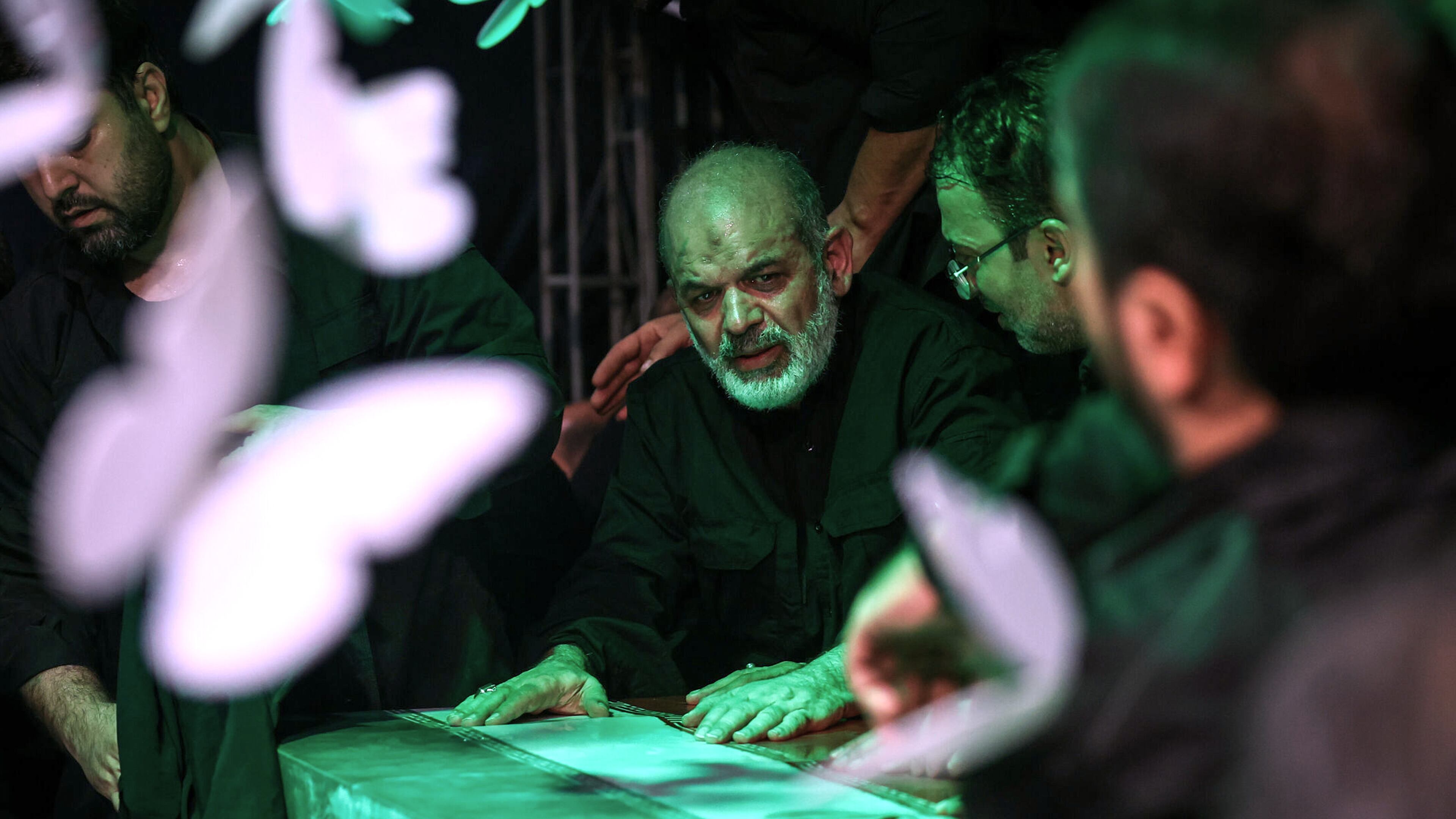 In this photo released by Iran's Supreme Leader's office, Iran's paramilitary Revolutionary Guard Gen. Ahmad Vahidi sits alongside Iran's Supreme Leader Ayatollah Ali Khamenei casket as it lies in a mourning hall adjacent to the Imam Khomeini Hussainiya within the Supreme Leader's compound before his funeral in Tehran, Iran, late Thursday, July 2, 2026. (Office of the Iranian Supreme Leader via AP)
