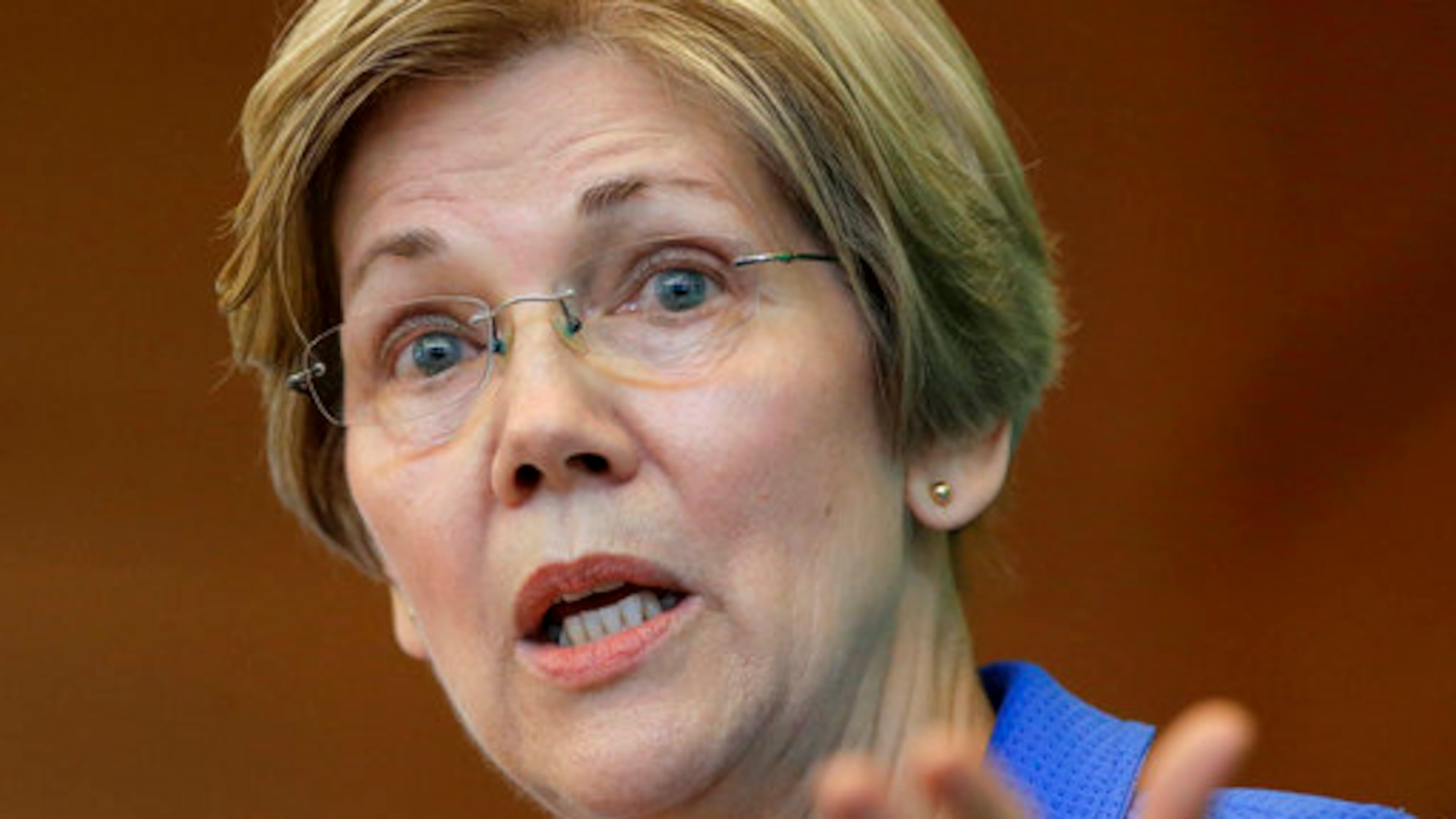FILE- In this March 27, 2017, file photo, U.S. Sen. Elizabeth Warren, D-Mass., addresses business leaders during a New England Council luncheon in Boston. Warren is revving up her already formidable fundraising juggernaut, raking in more than $5.2 million in the first quarter of the year to bring her campaign account to more than $9.2 million according to fundraising totals released Wednesday, April 12, by her campaign. (AP Photo/Steven Senne, File)