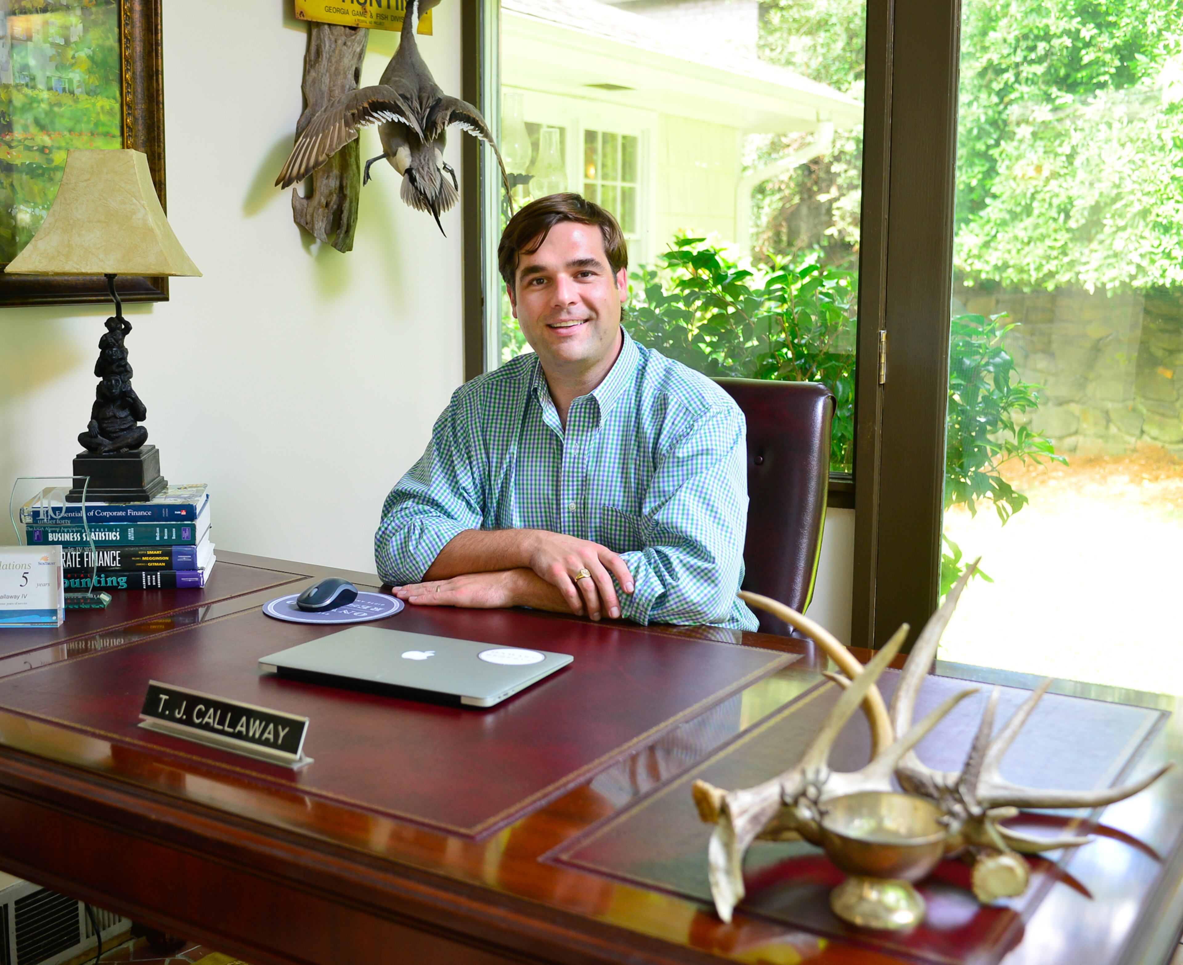 Homeowner TJ Callaway appreciates furniture and accessories with a story, like how he got the antlers on his desk. Callaway killed his first buck in Mississippi on what used to be Onward Plantation - the inspiration for the name of his retail business, Onward Reserve. The property owners collect antler sheds each year, and he was able to find his trophy's shed from the prior year.