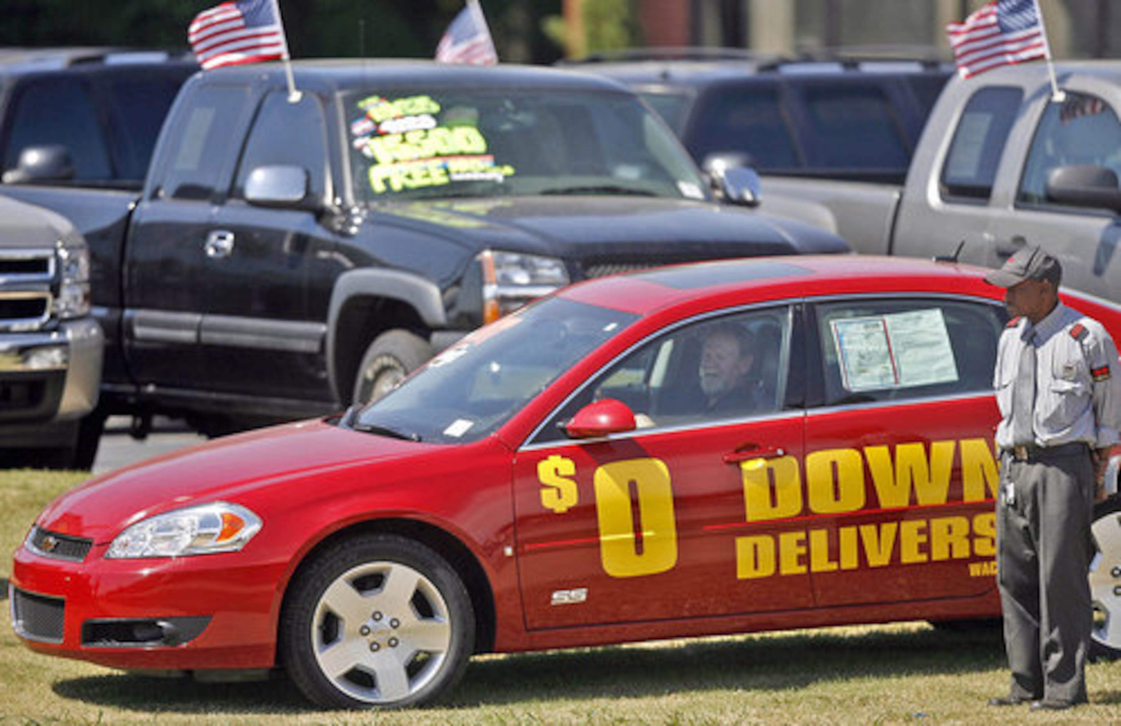 Vehicles at the dealership in Buford are moved from the front, near the road, to the lot.