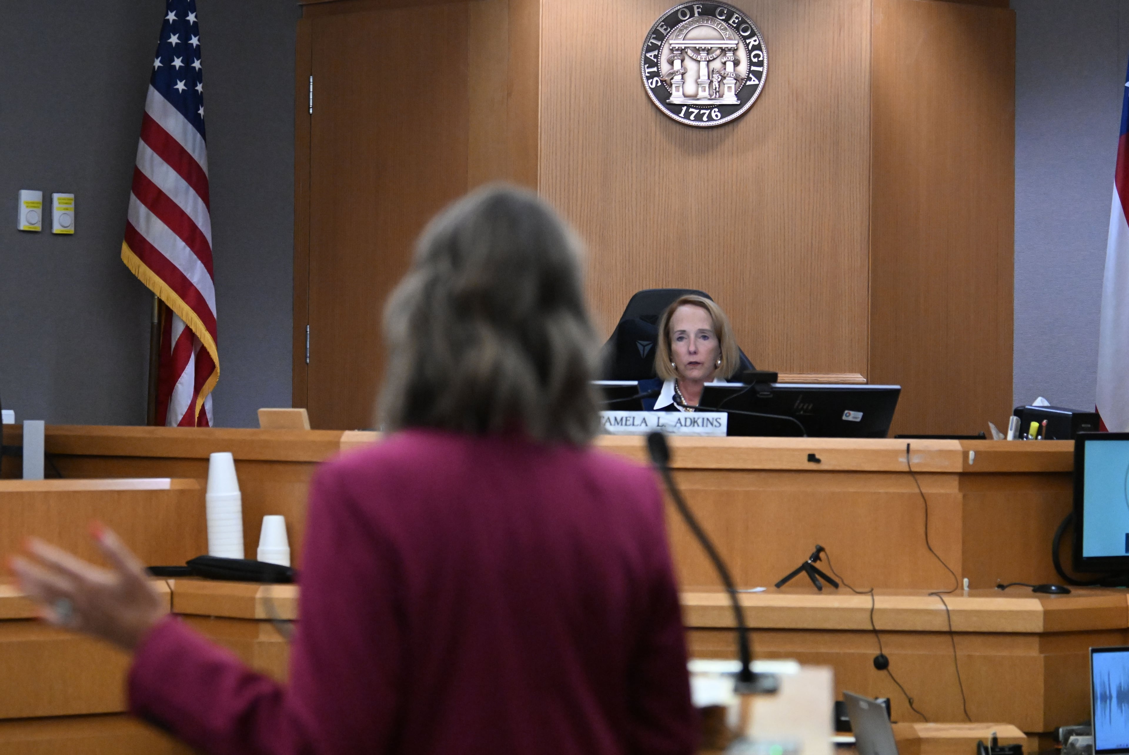 Trinity Hundredmark (foreground), one of Deja Coleman’s attorneys, speaks before Gwinnett County Superior Court Judge Tamela Adkins during Coleman’s bond hearing on Wednesday, Sept. 9, 2026. (Hyosub Shin/AJC)