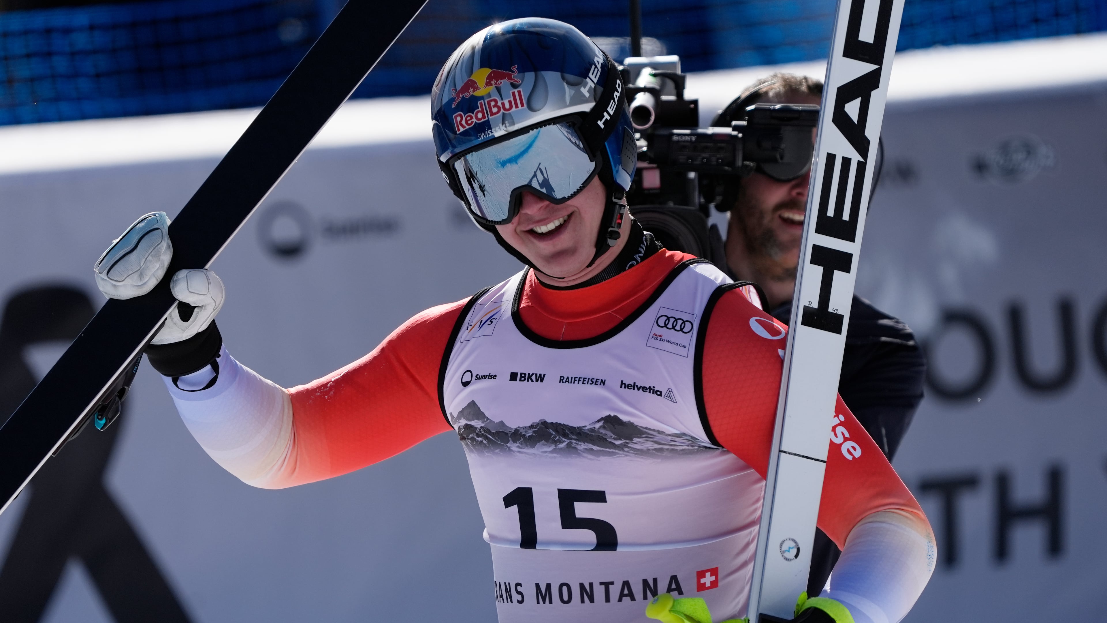 Switzerland's Franjo von Allmen celebrates at the finish area of an alpine ski, men's World Cup downhill, in Crans Montana, Switzerland, Sunday, Feb. 1, 2026. (AP Photo/Giovanni Auletta)
