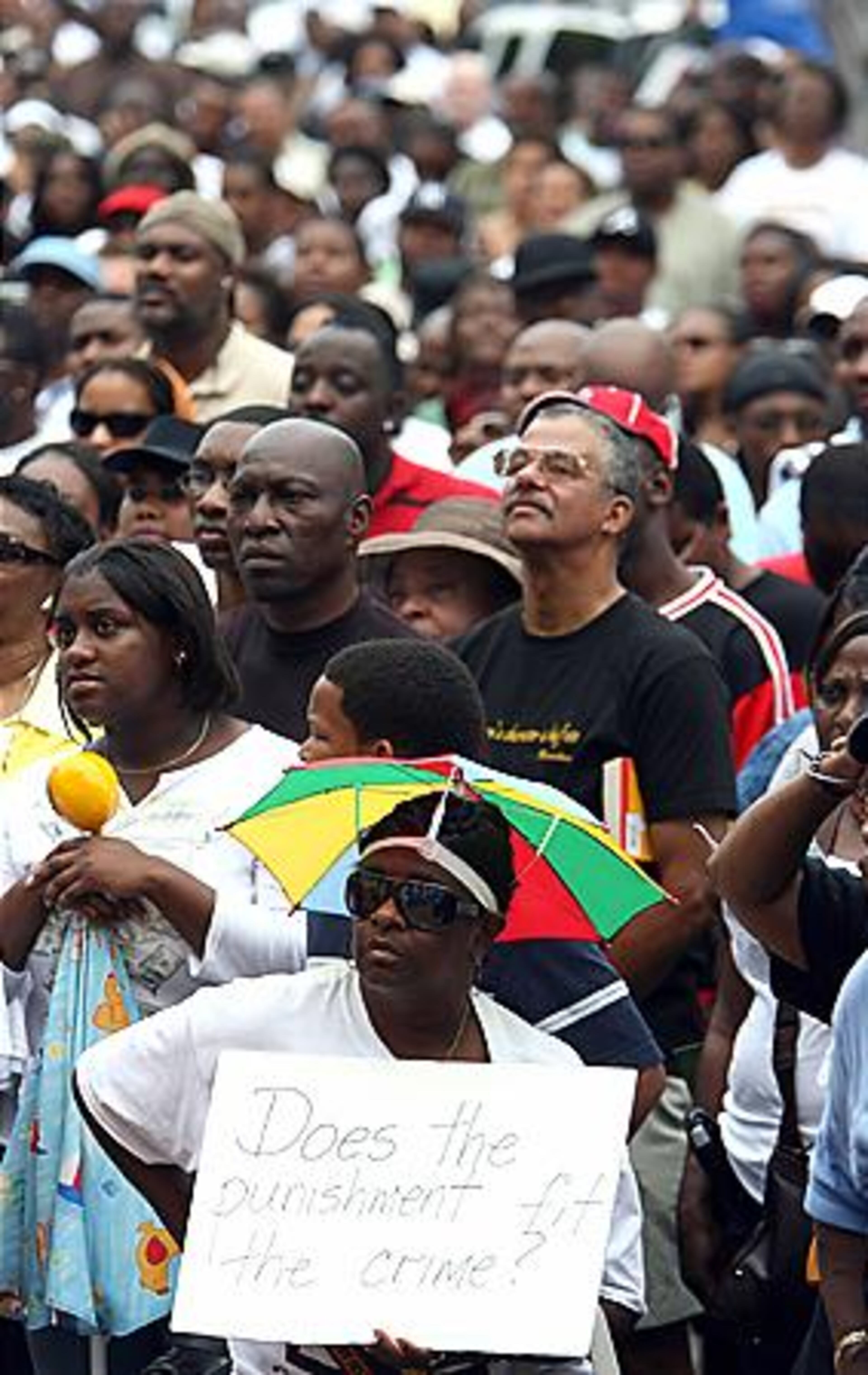 Misty Shell of Covington sits in the front row during a rally in support of Wilson at the Douglas County Courthouse.