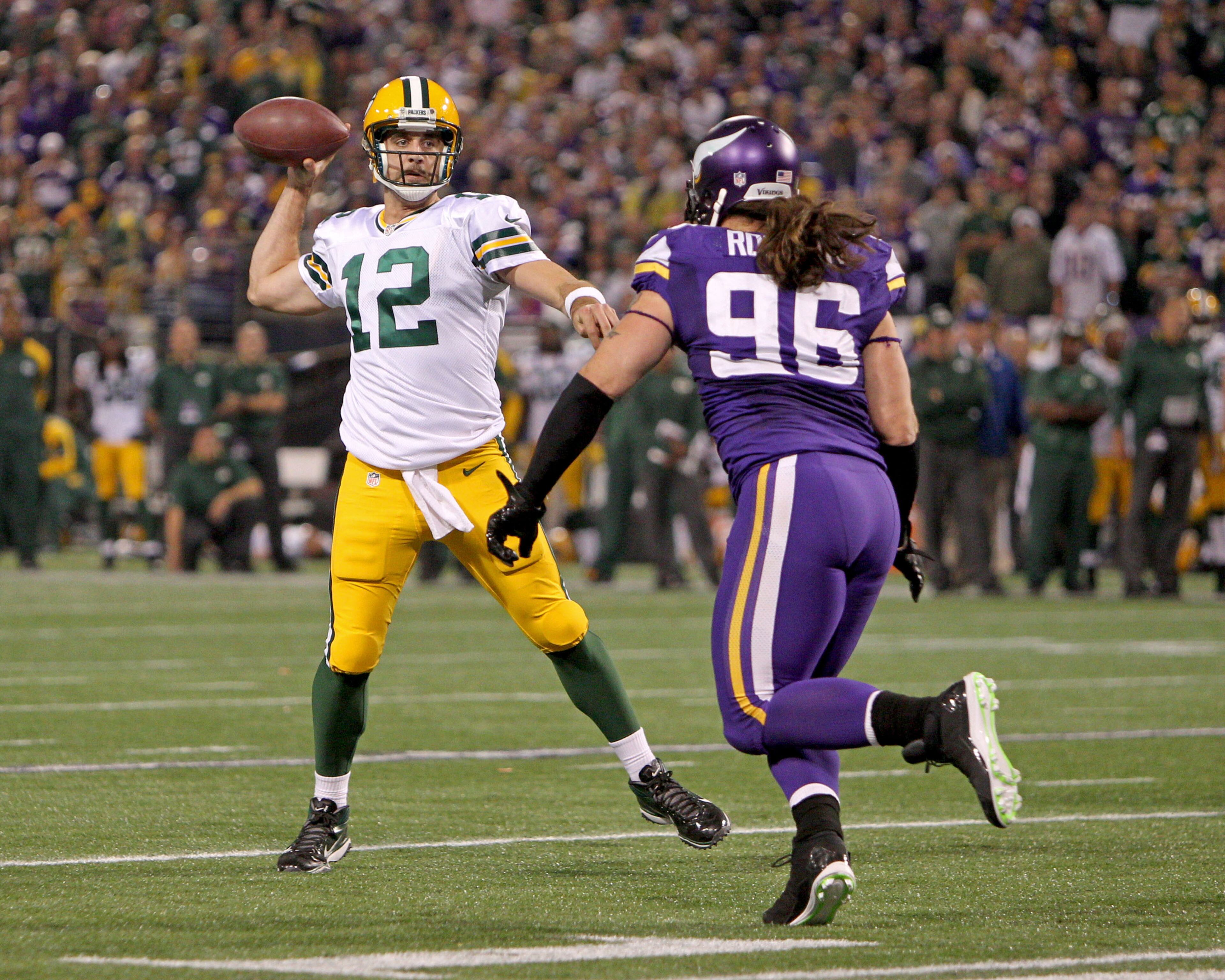 Green Bay Packers quarterback Aaron Rodgers (12) throws over Minnesota Vikings defensive end Brian Robison (96) during the third quarter at Mall of America Field at H.H.H. Metrodome. The Green Bay Packers defeated the Minnesota Vikings 44-31. (Brace Hemmelgarn-USA TODAY Sports)