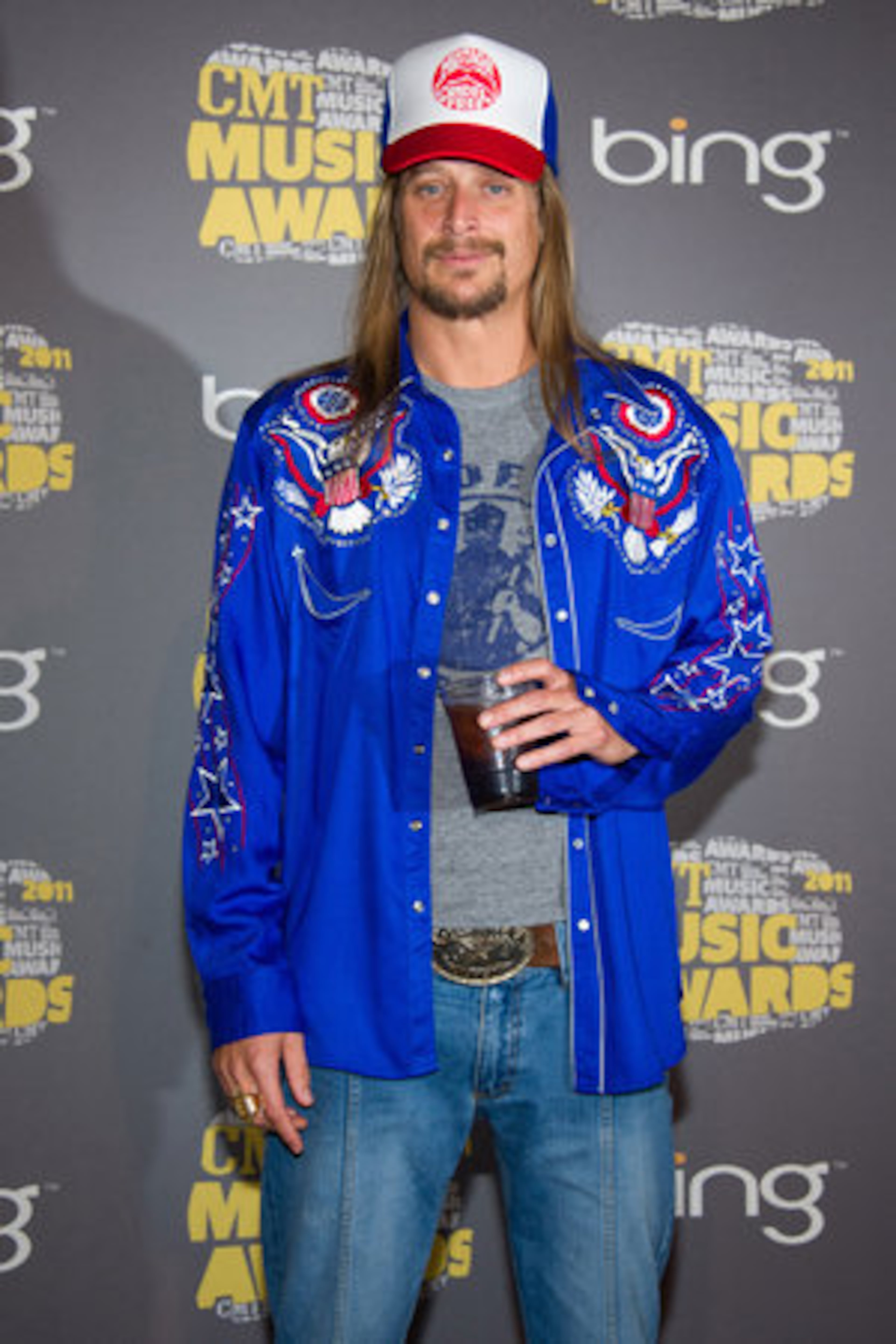 Kid Rock has a drink backstage.