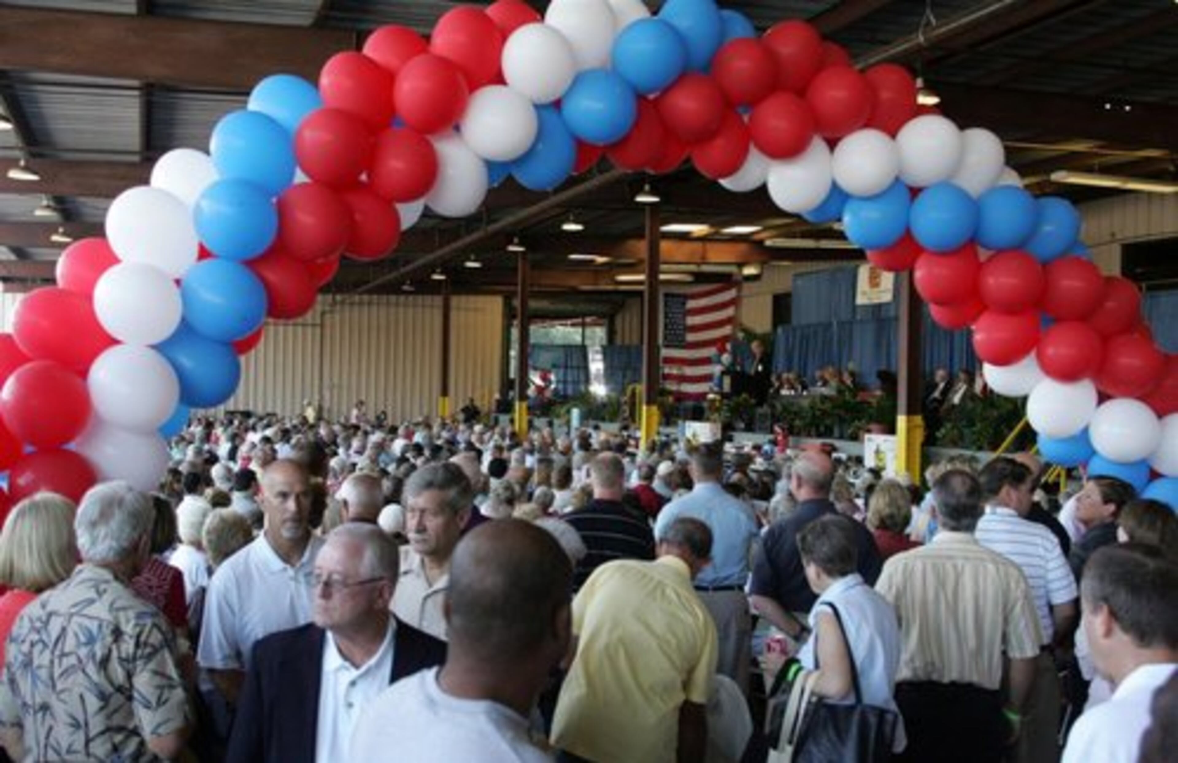 The co-op held its annual meeting in a covered loading dock in its Marietta facility. Several co-op members sued Cobb EMC and Cobb Energy last fall, saying the relationship between the two had siphoned co-op assets.