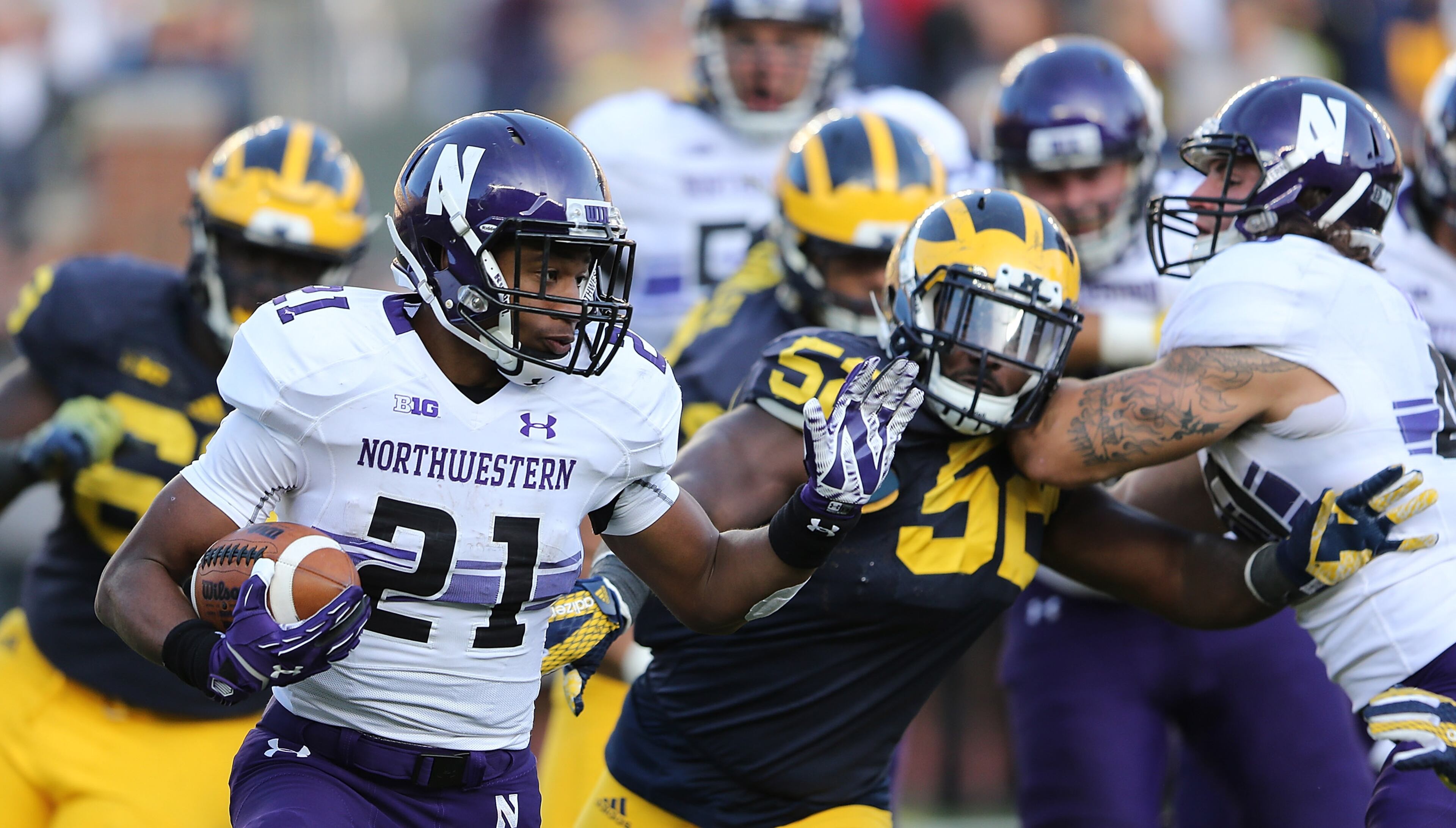 Junior Justin Jackson (21) of Northwestern rushed for 1,418 yards on 312 carries last season and scored five touchdowns rushing. (Photo by Leon Halip/Getty Images)
