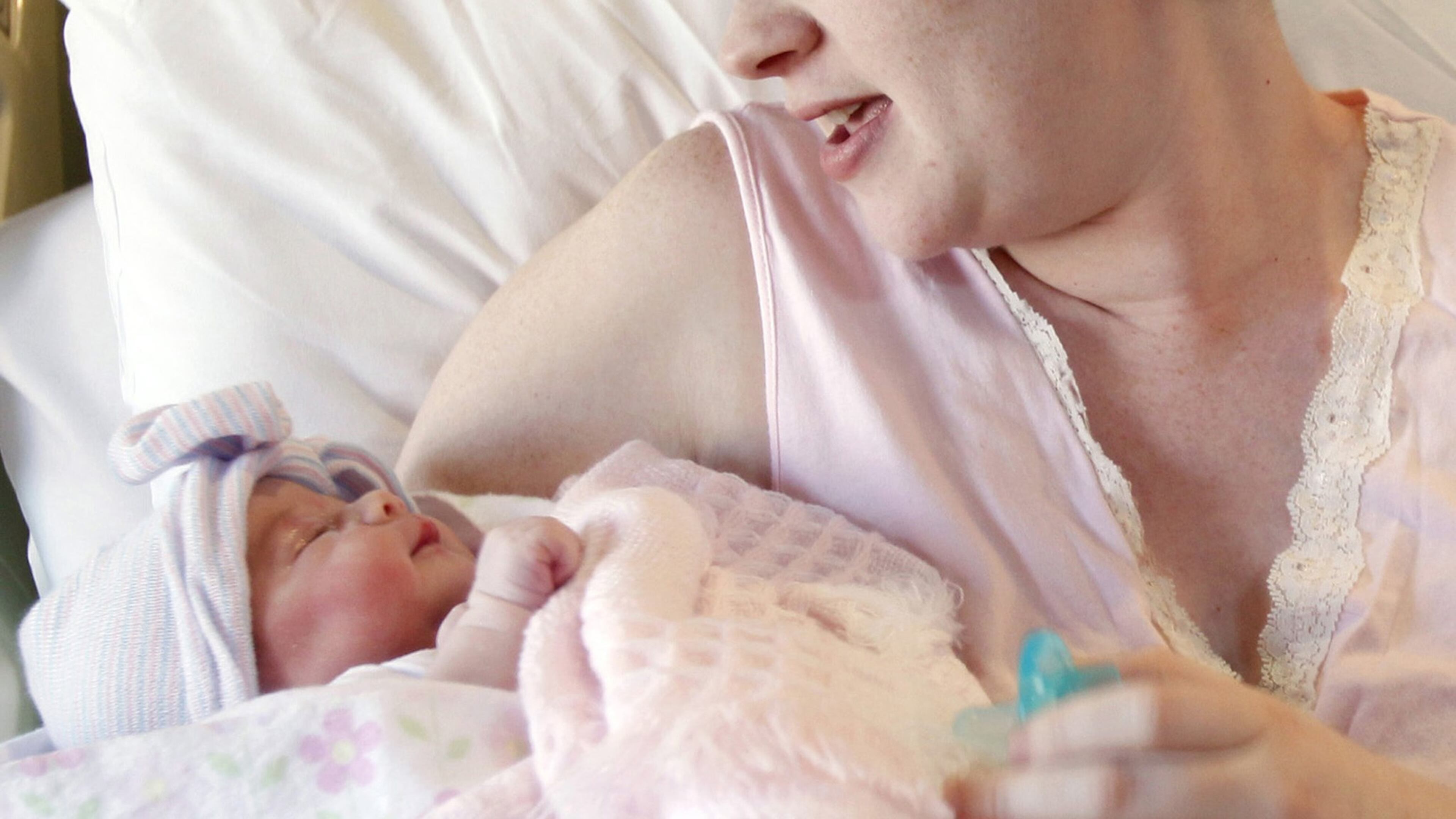 FILE - In this Friday, Nov. 11, 2011 file photo, a mother holds her newborn baby at a hospital in Corpus Christi, Texas. A study released Monday, Dec. 19, 2016 shows pregnancy affects not only a woman’s body: It changes parts of her brain structure too. (Michael Zamora/Corpus Christi Caller-Times via AP)