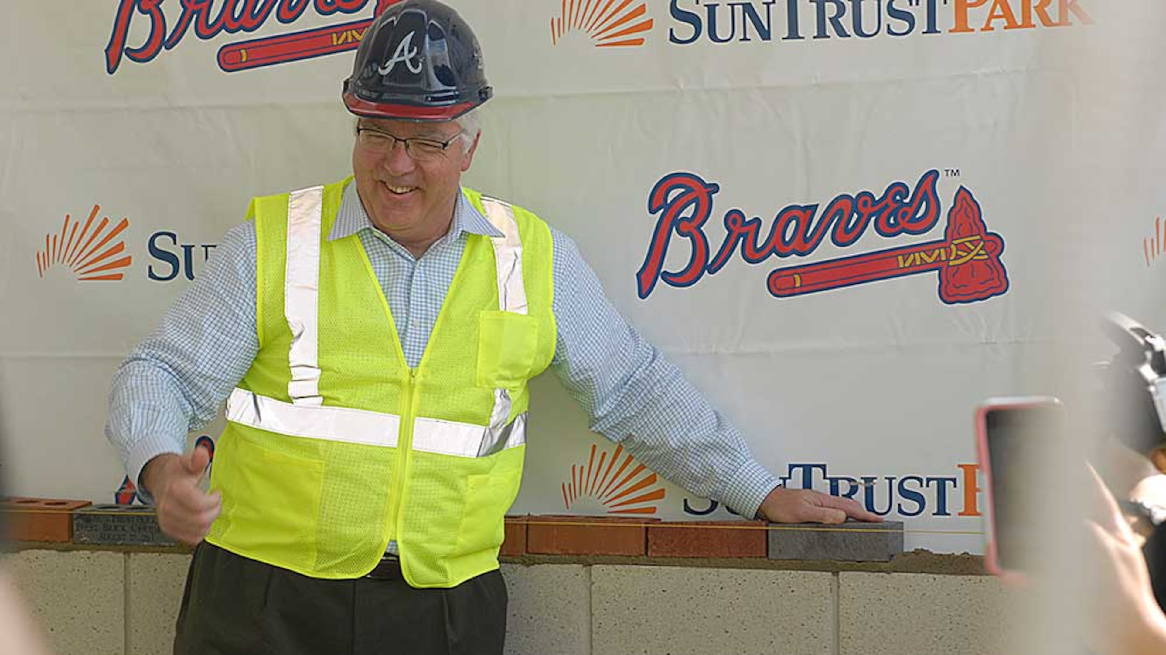 Tim Lee sets a brick at an event in 2015 featuring time capsules and the laying of ceremonial first bricks at SunTrust Park.