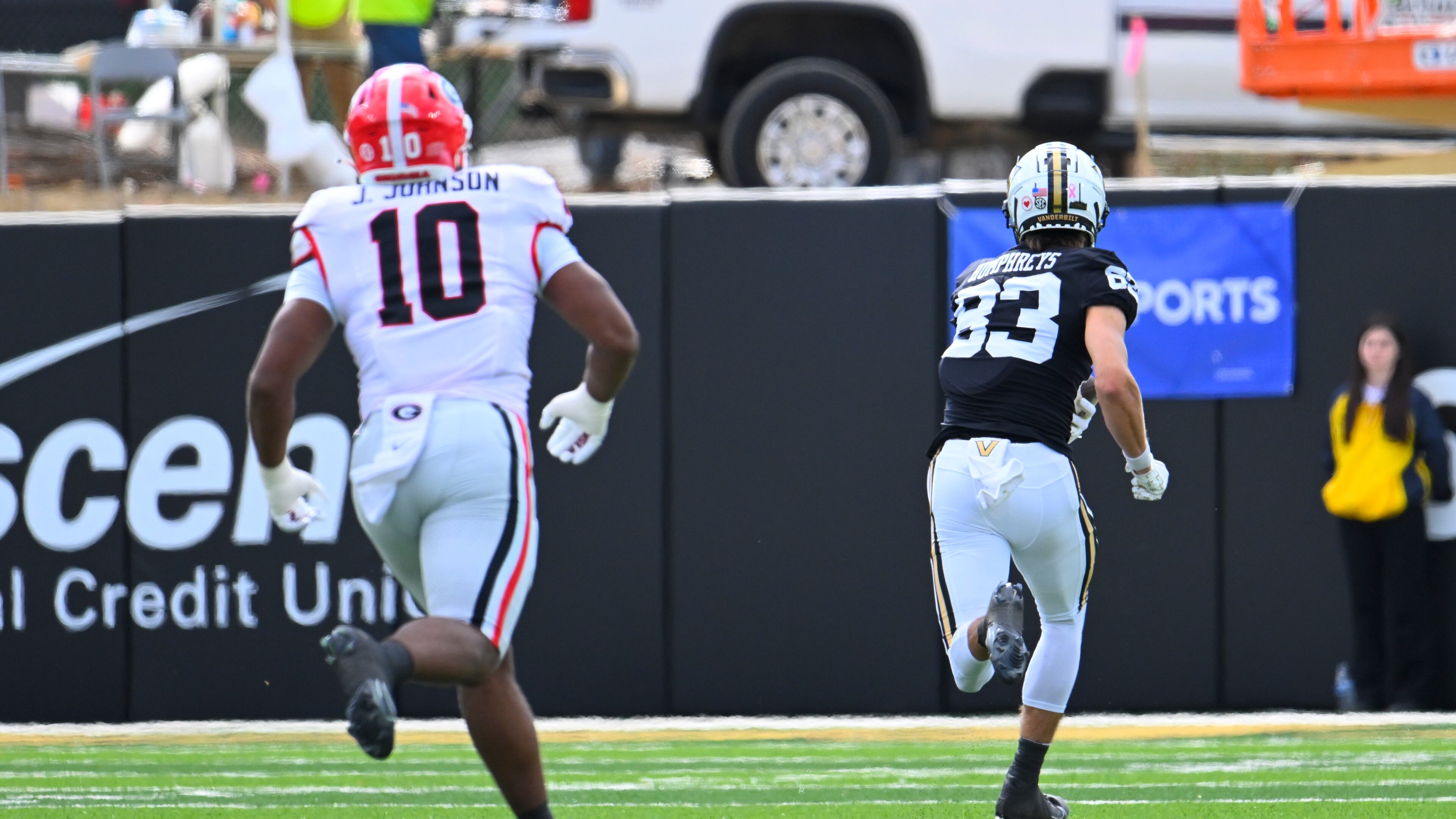 Vanderbilt wide receiver London Humphreys (83) runs for a touchdown as Georgia linebacker Jamon Dumas-Johnson (10) chases during the first quarter of an NCAA football game, Saturday, Oct. 14, 2023, in Nashville, Tenn. (Special to the AJC/John Amis)