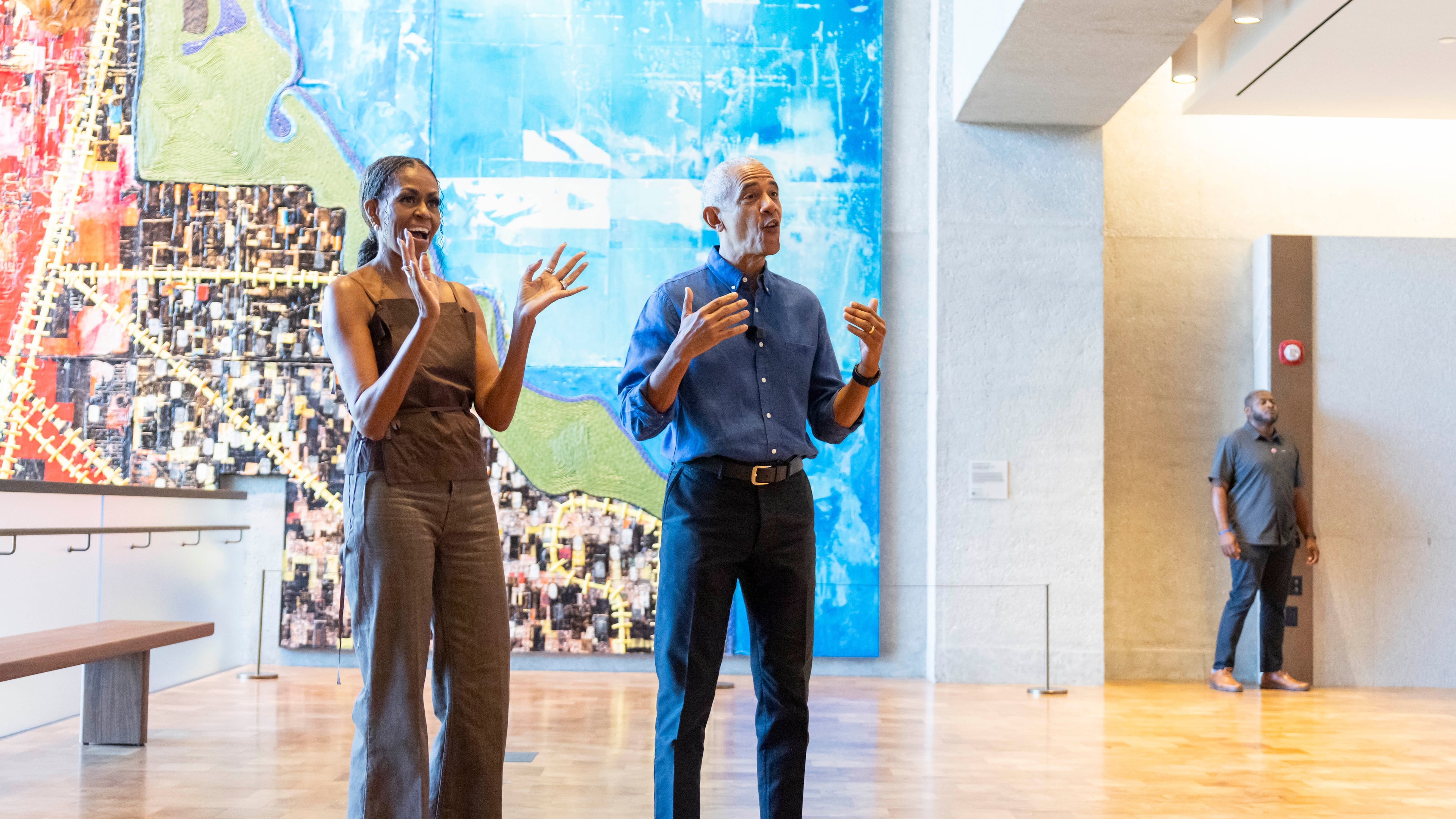 Former President Barack Obama and former first lady Michelle Obama welcome community members in the Hope and Change lobby before they walk through the museum at the Obama Presidential Center in Chicago on Friday, June 19, 2026. (Eileen T. Meslar/Chicago Tribune via AP, Pool)