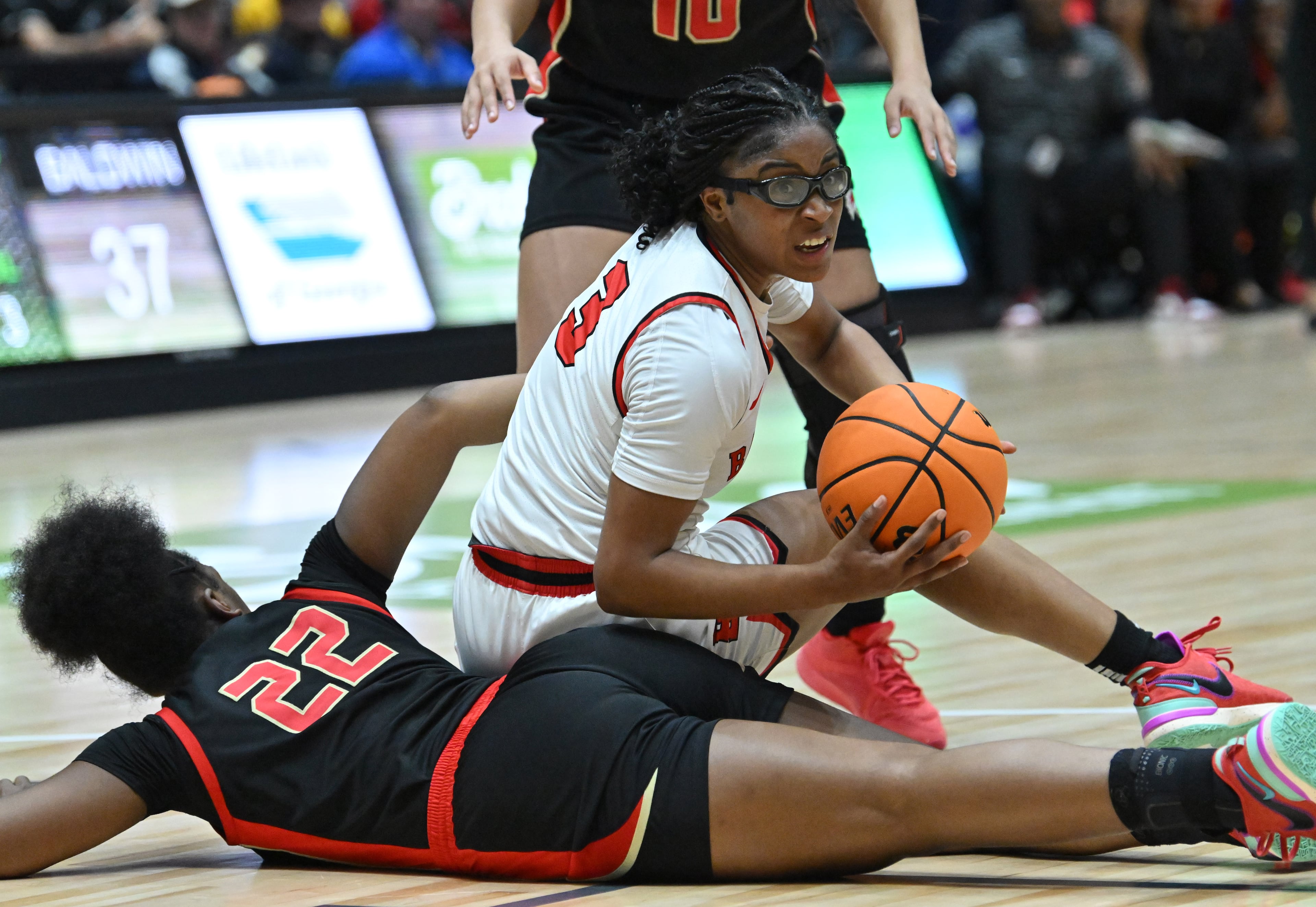 Baldwin's Madison Ruff (3) gets off a pass as she collides with Hardaway's Jenaiya Hardy (22) during the second half of GHSA Basketball Class 4A Girl’s State Championship game at the Macon Centreplex, Wednesday, Mar. 6, 2024, in Macon. Baldwin won 47-39 over Hardaway. (Hyosub Shin / Hyosub.Shin@ajc.com)