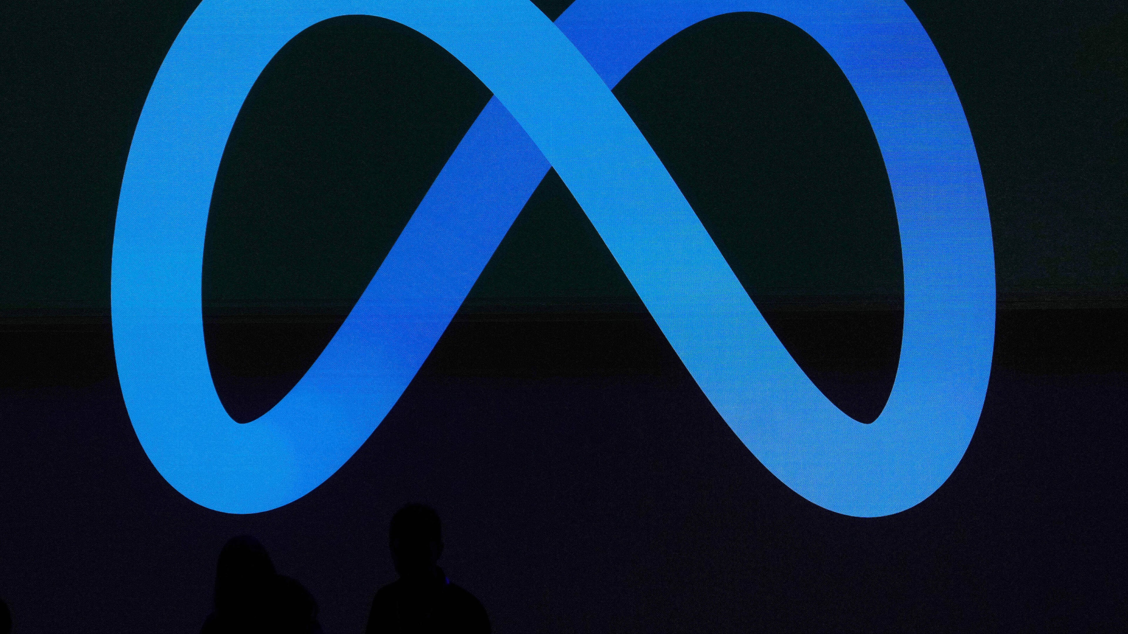 FILE -A Meta logo is shown on a video screen at LlamaCon 2025, an AI developer conference, in Menlo Park, Calif., April 29, 2025. (AP Photo/Jeff Chiu, File)