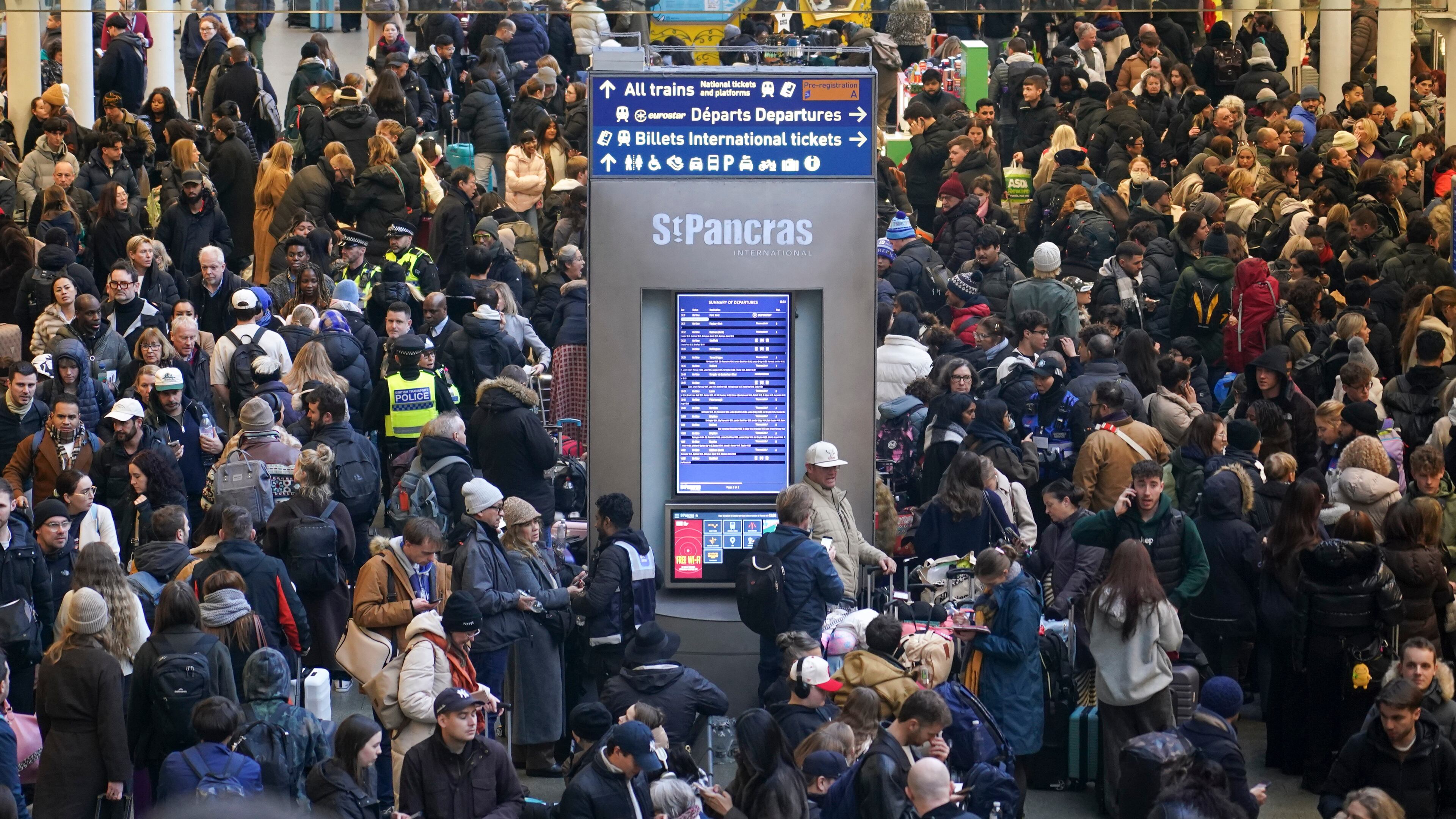 Travelers queue for Eurostar services at St Pancras International station in London, Tuesday, Dec. 30, 2025. (AP Photo/Alberto Pezzali)