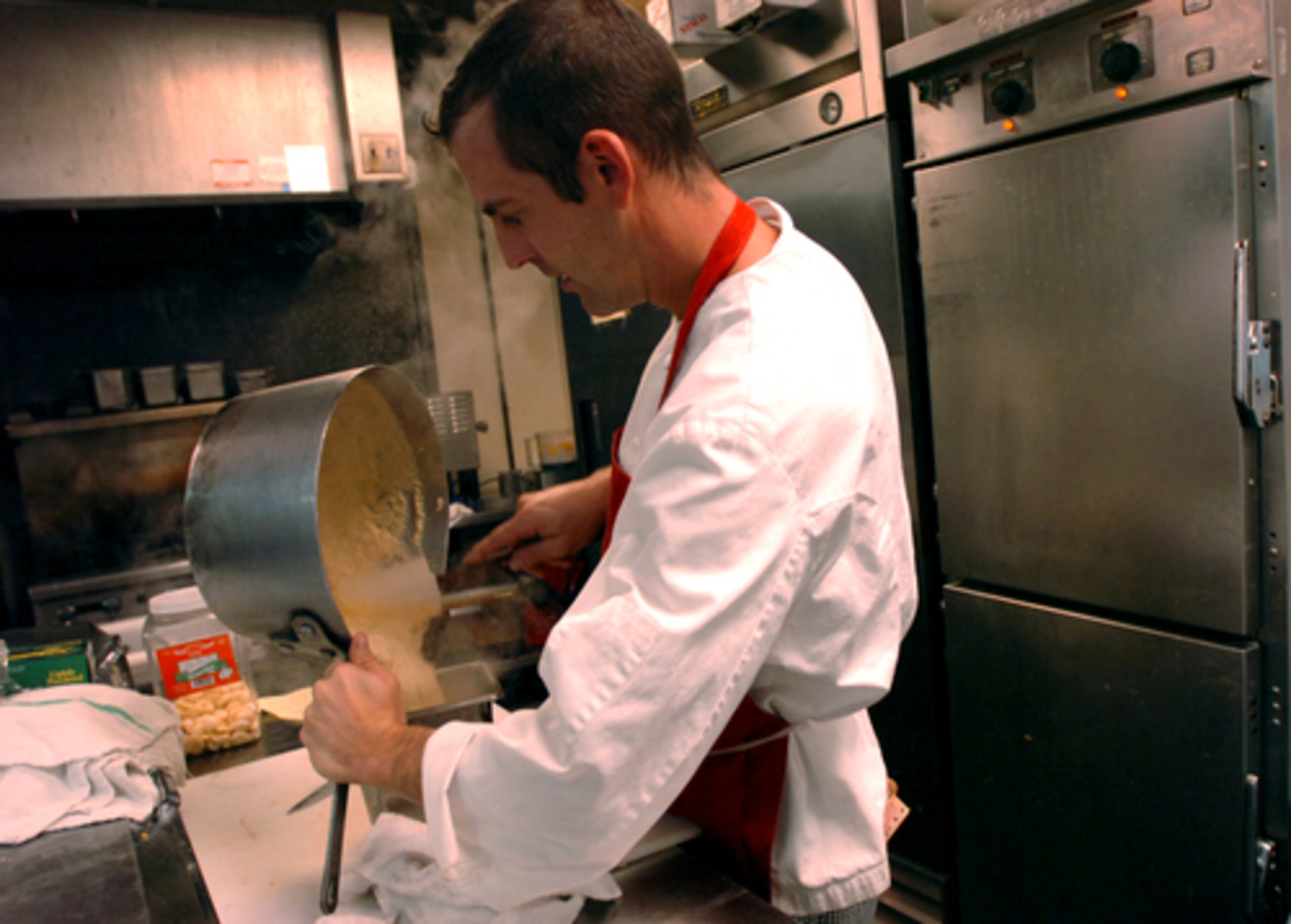 New chef Ryan Cobb prepares for dinner service in the kitchen of the Colannade. This is his first year serving the Thanksgiving meal at the restaurant, but he says he "does not scare easily."