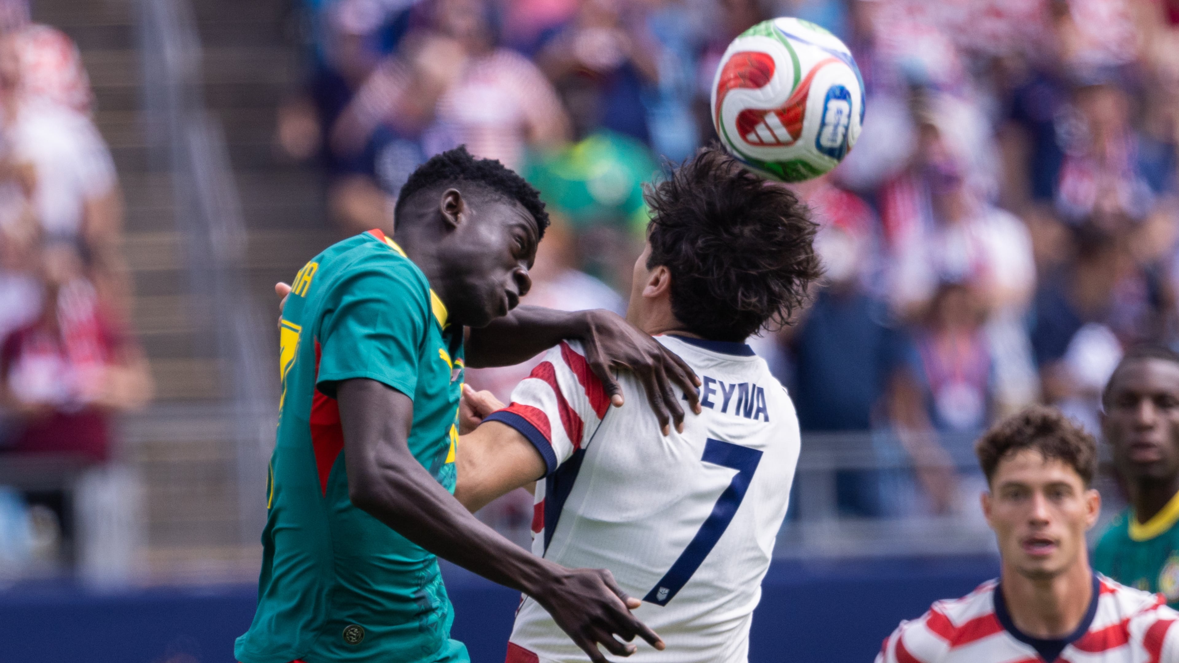 Senegal midfielder Bara Ndiaye (left) and United States midfielder Giovanni Reyna (7) head the ball during the first half of an international friendly Sunday, May 31, 2026, in Charlotte, North Carolina. (Scott Kinser/AP)
