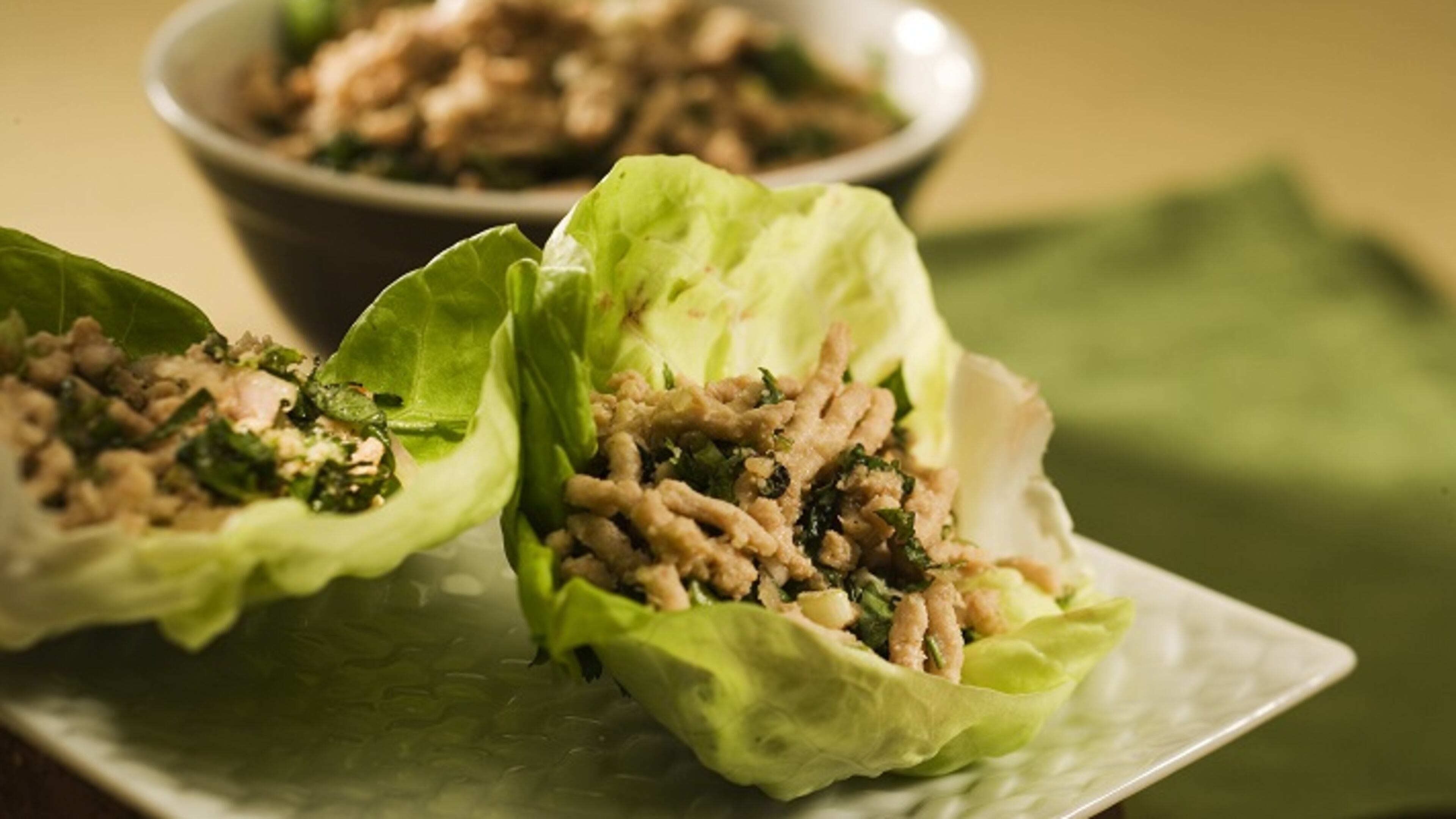 Tuck Thai-spiced ground chicken into lettuce wraps, and pop open a bottle of wine. (Bob Fila/Chicago Tribune/TNS)