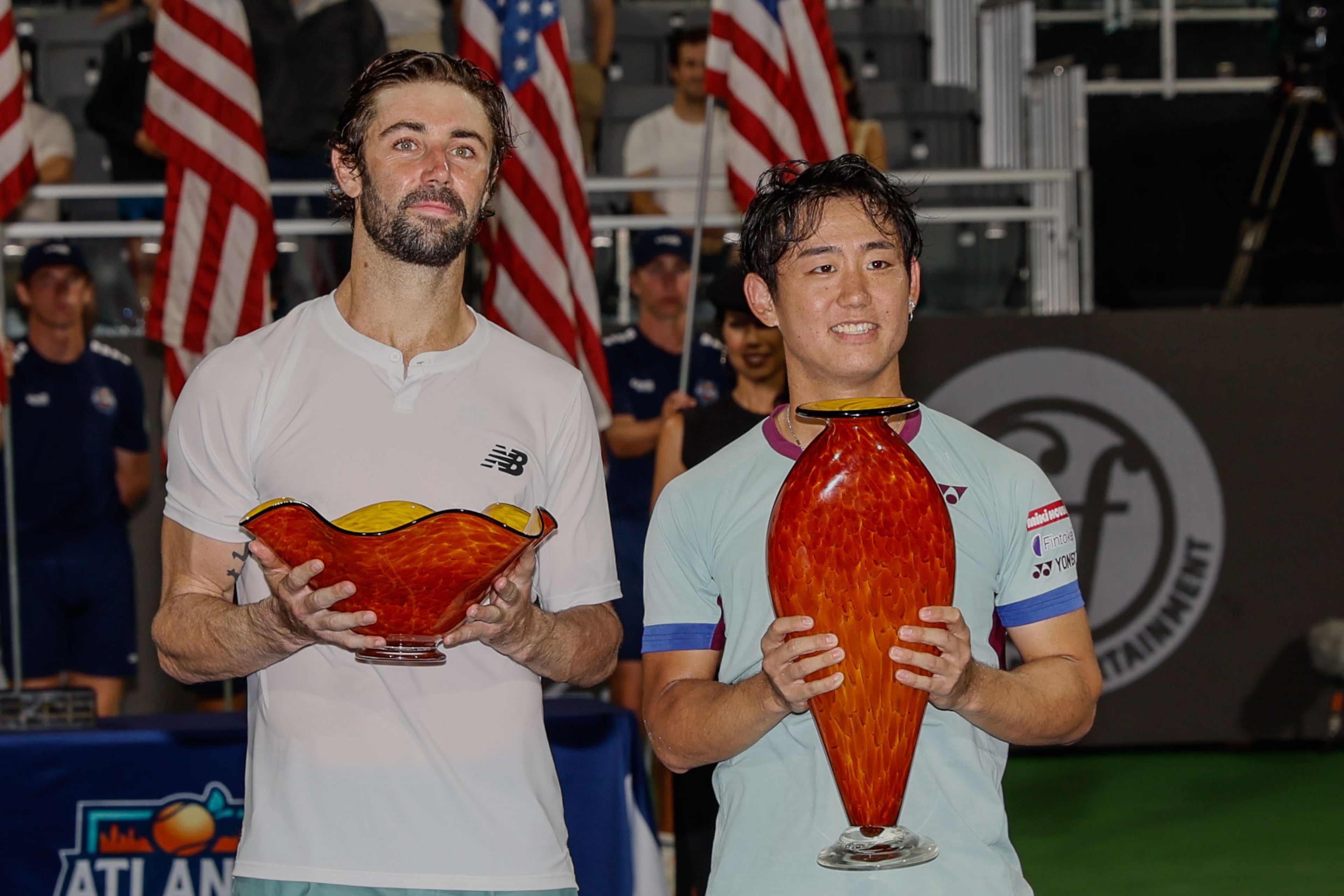 Japan’s Yoshihito Nishioka, the 2024 Atlanta Open winner, is pictured with Jordan Thompson holding their trophy at Atlantic Station in Atlanta on Sunday, July 28, 2024.
(Miguel Martinez / AJC)