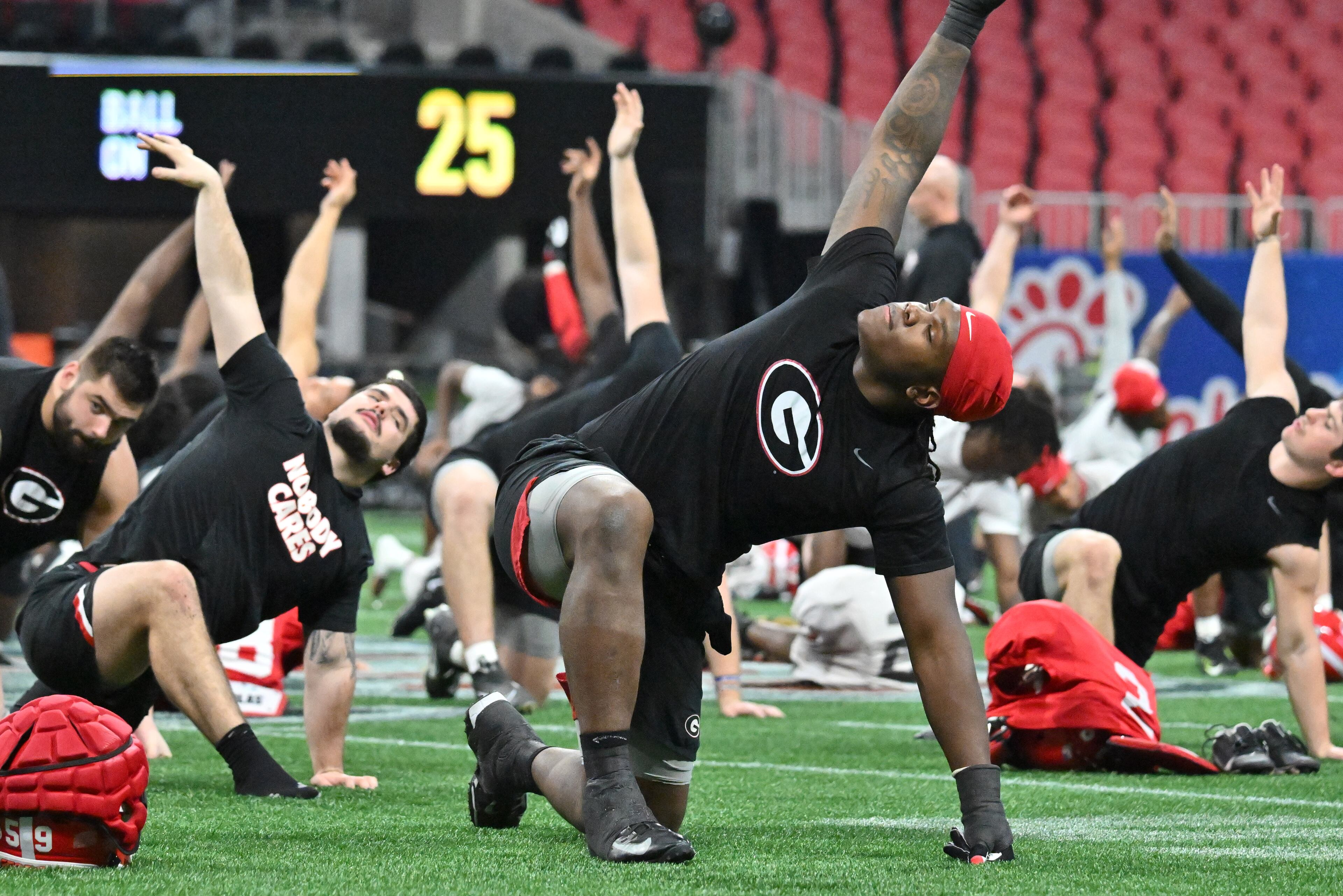 Georgia players stretch during a practice session for the Chick-fil-A Peach Bowl game against Ohio State at the Mercedes-Benz Stadium on Thursday, Dec. 29, 2022, in Atlanta. (Hyosub Shin / Hyosub.Shin@ajc.com)