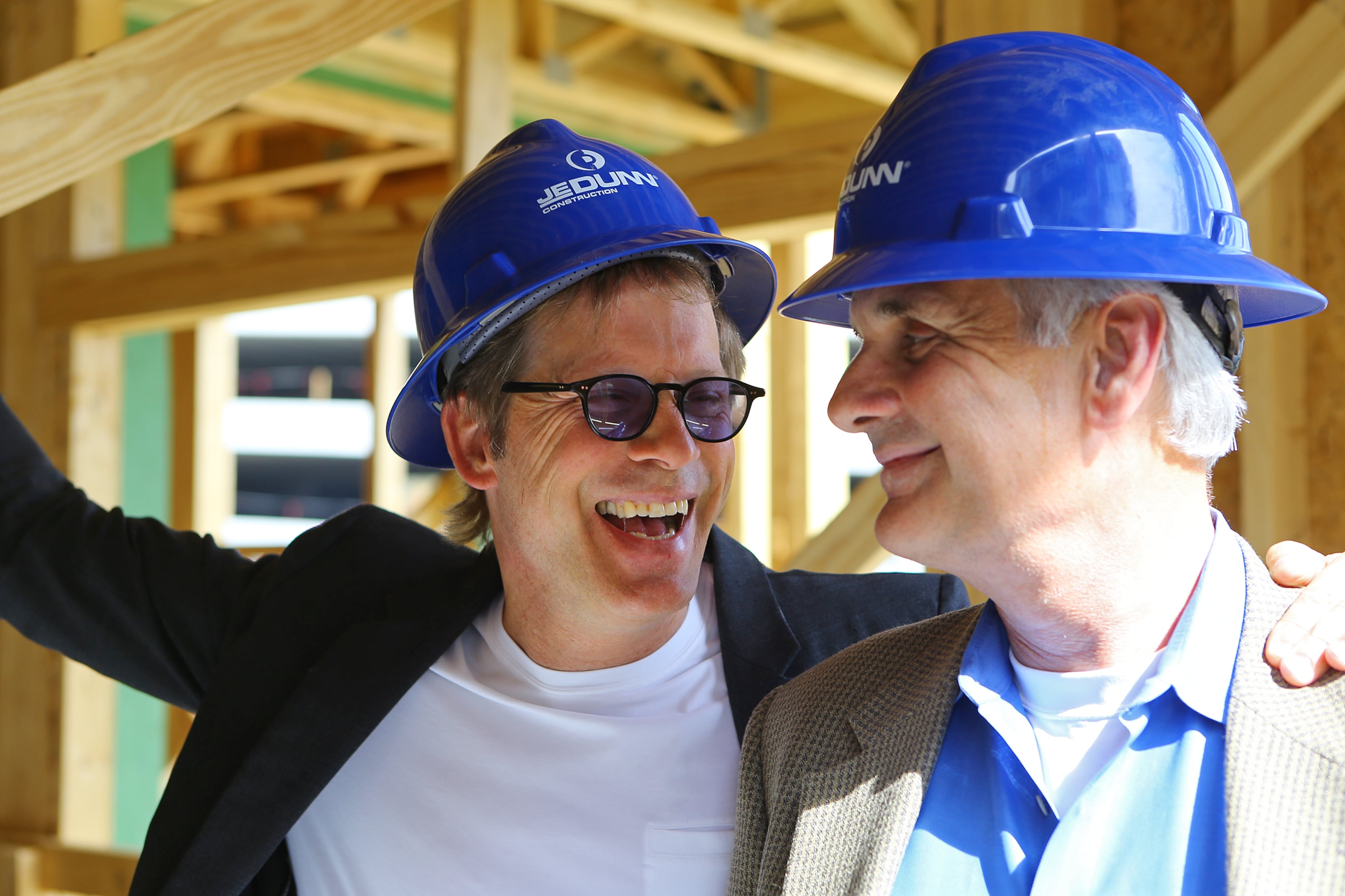 Jarel Portman (left) shares a laugh with partner Bruce Fernald while touring their mixed-use project Inman Quarters on Wednesday, April 2, 2014, in Atlanta. His father is Atlanta architect John Portman, who shaped much of downtown Atlanta. CURTIS COMPTON / CCOMPTON@AJC.COM