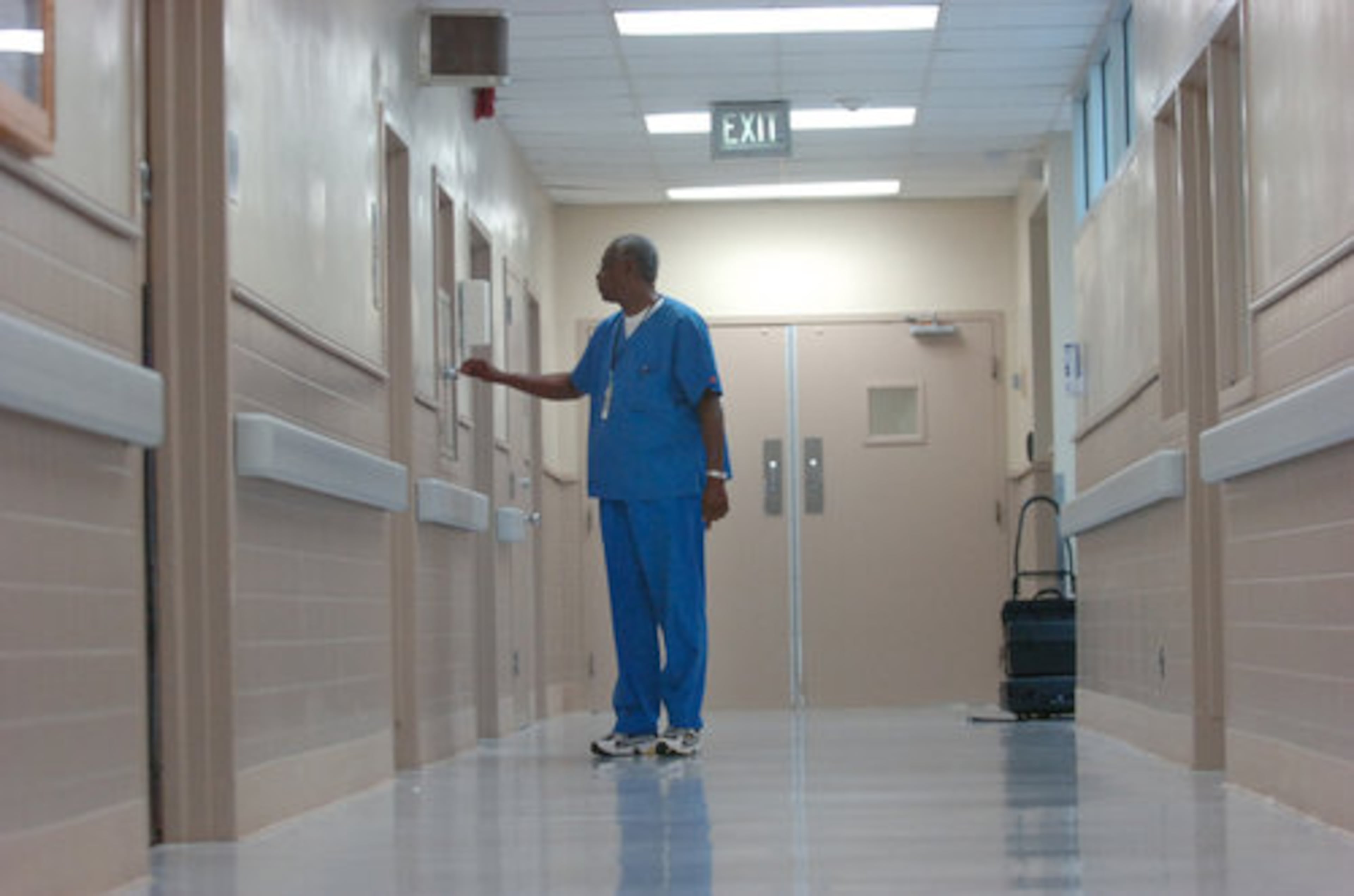 Sam Bivins, director of radiology, walks an empty hallway of Southwest Atlanta Hospital. The hospital reopened last month with new owners after twice closing in three years. On the day of this photo, it had one patient.