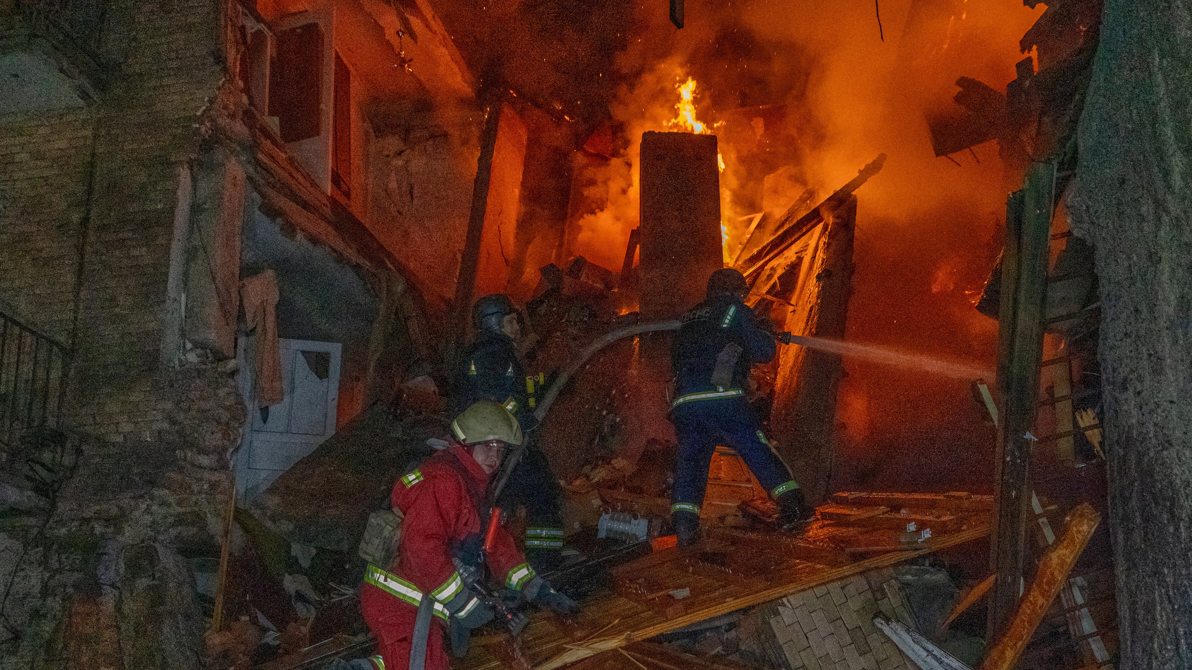 Firefighters put out a fire following a Russian air attack on a residential building in Kharkiv, Ukraine, Tuesday, Oct. 13, 2026. (AP Photo/Andrii Marienko)