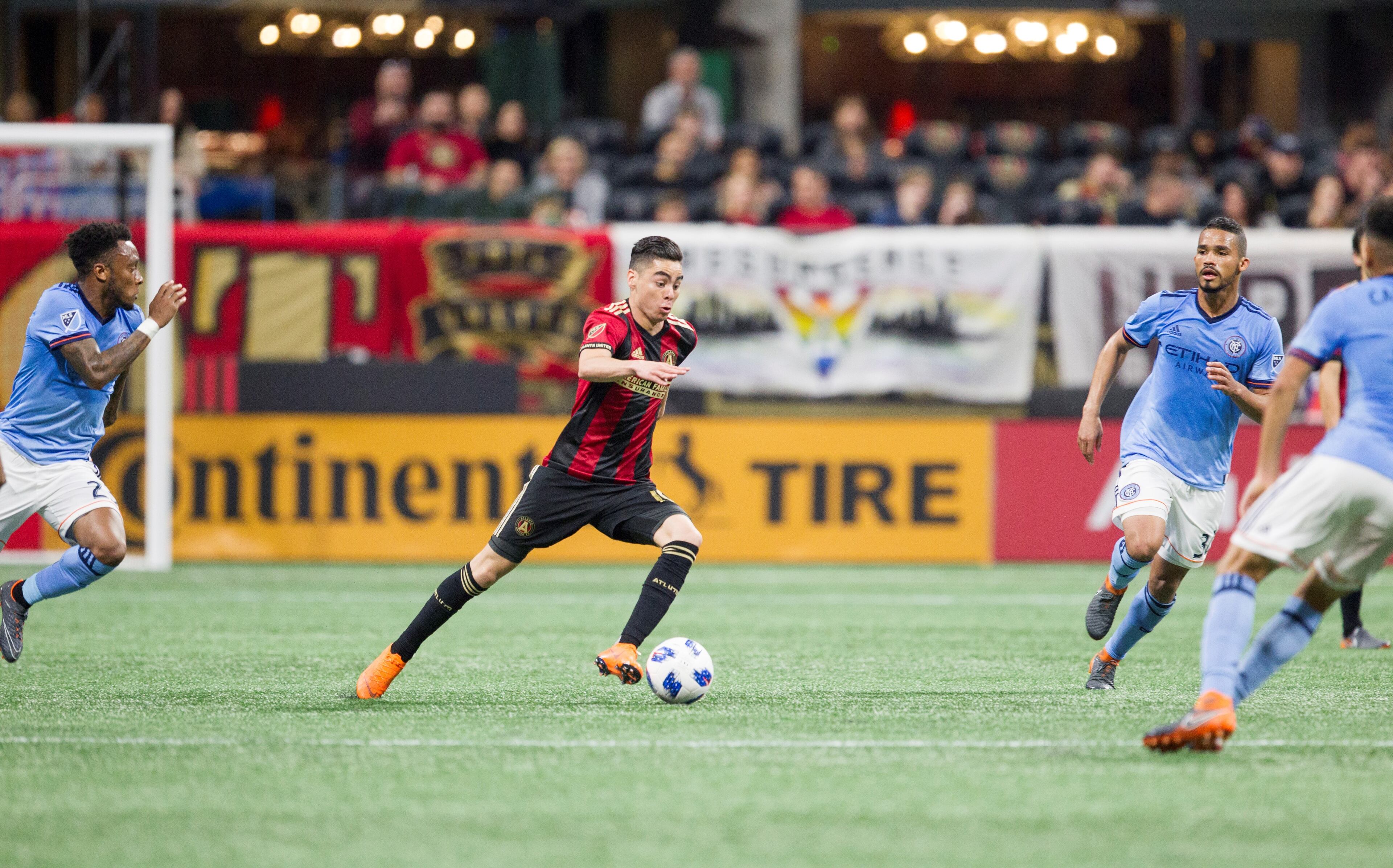 Atlanta United midfielder Miguel Almiron (10) runs down the field with the ball during the match between NYC FC and Atlanta United at Mercedes-Benz Stadium in Atlanta, Georgia, on Sunday, April 15, 2018. (REANN HUBER/REANN.HUBER@AJC.COM)