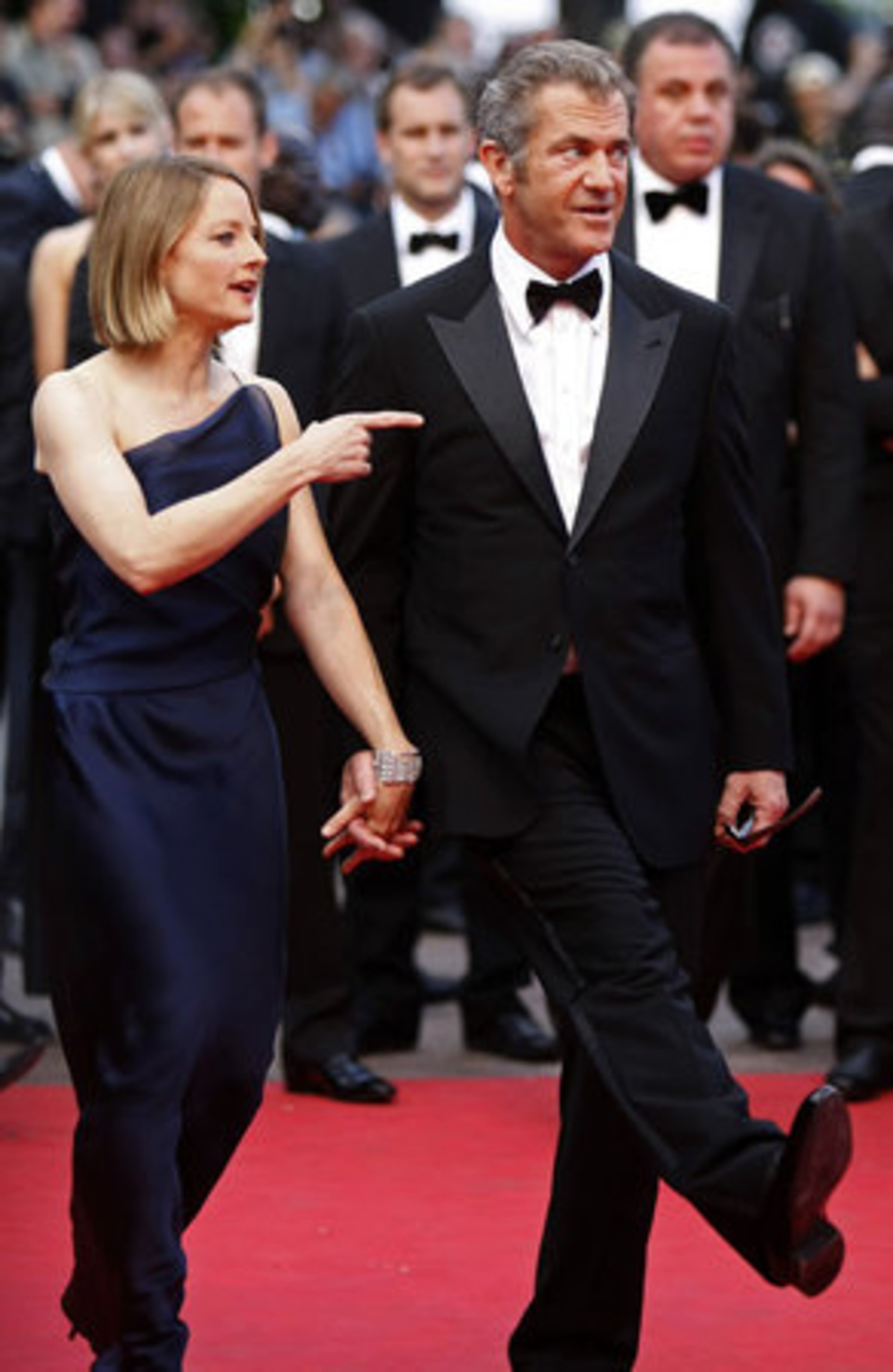 Mel Gibson looks like a scared child, as Jodie Foster holds his hand during their entire time together on the red carpet.