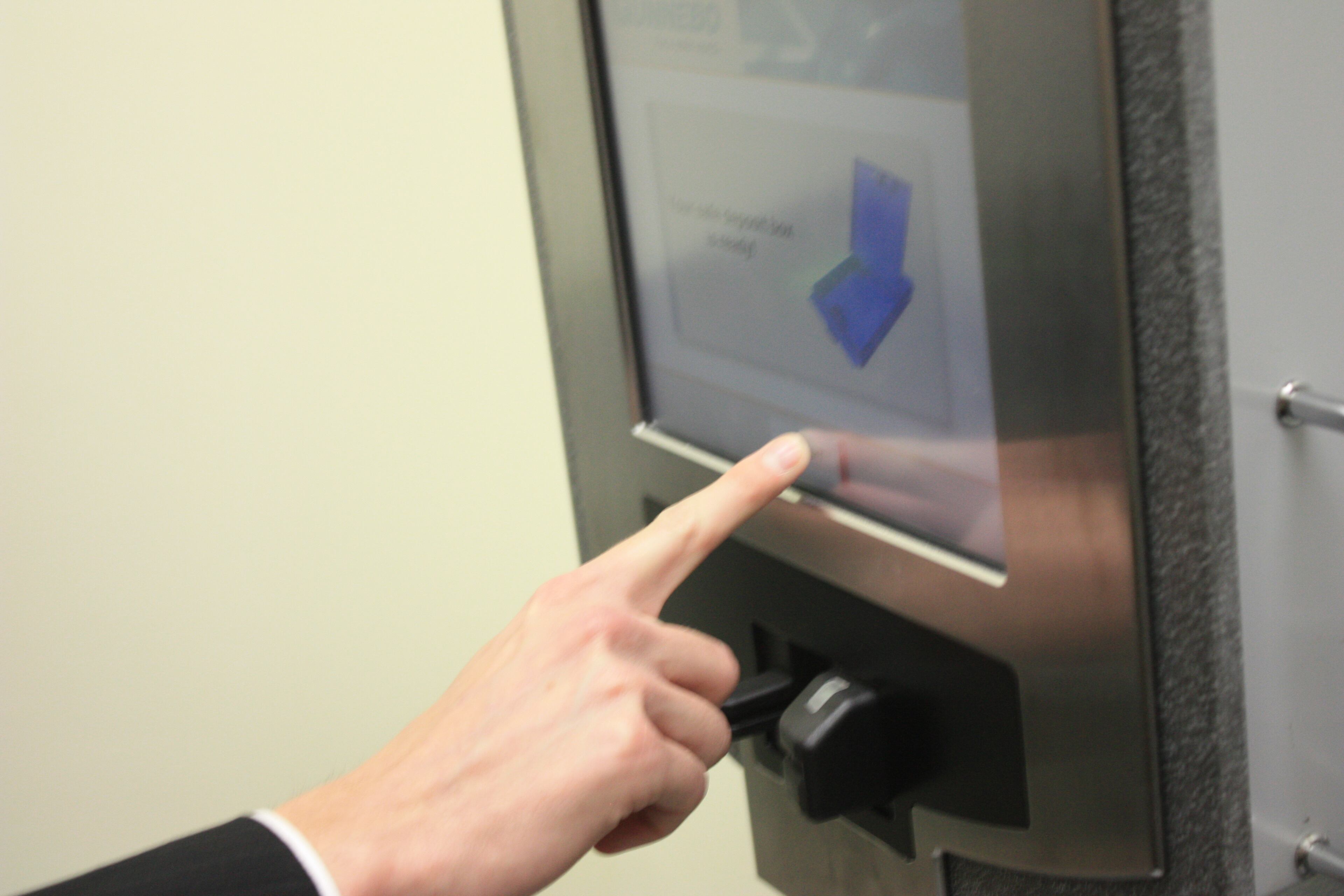 The customer re-locks the box and presses a button to tell the machine he or she is done.
