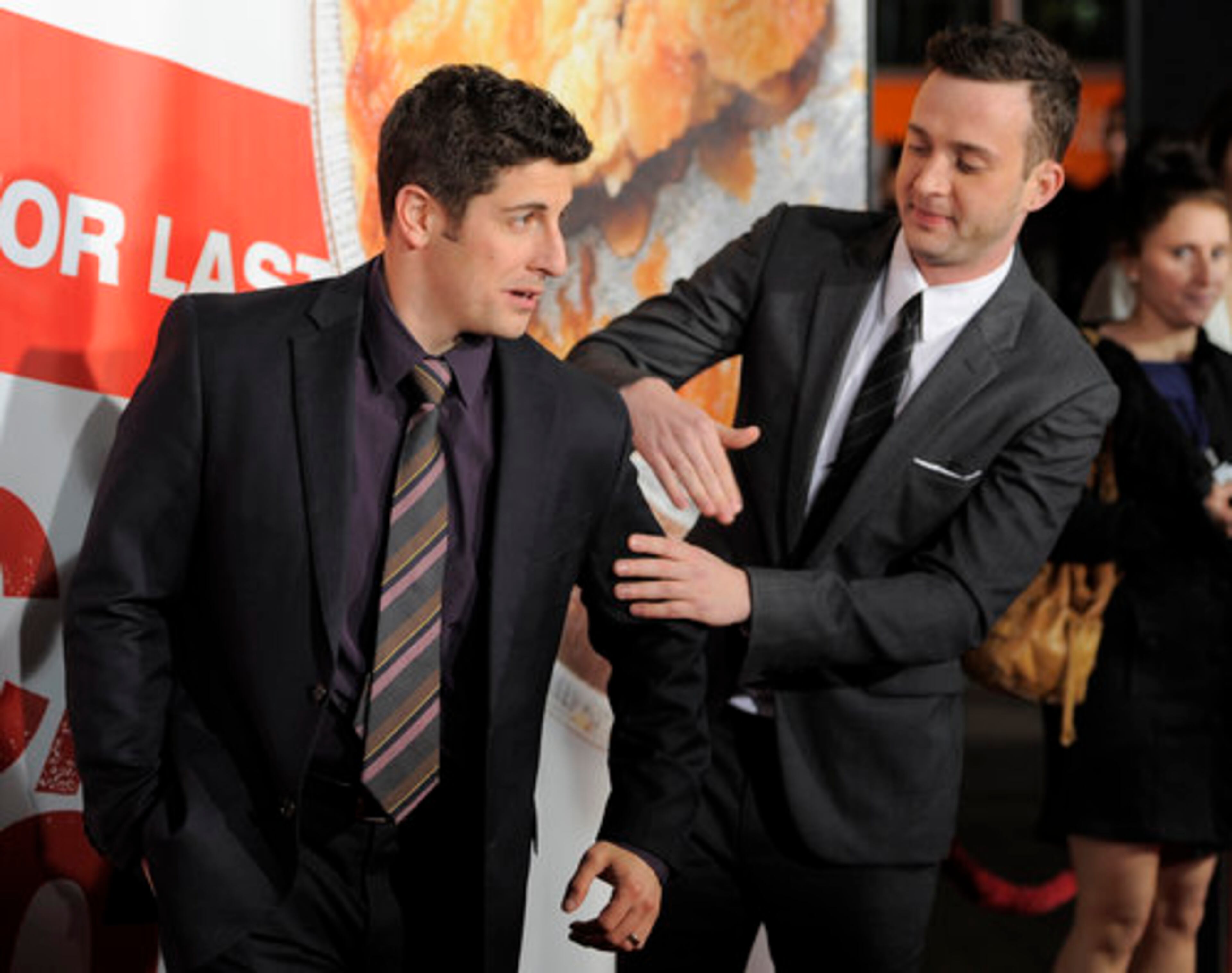 Here, let me get that for you: Eddie Kaye Thomas brushes off Jason Bigg's jacket.