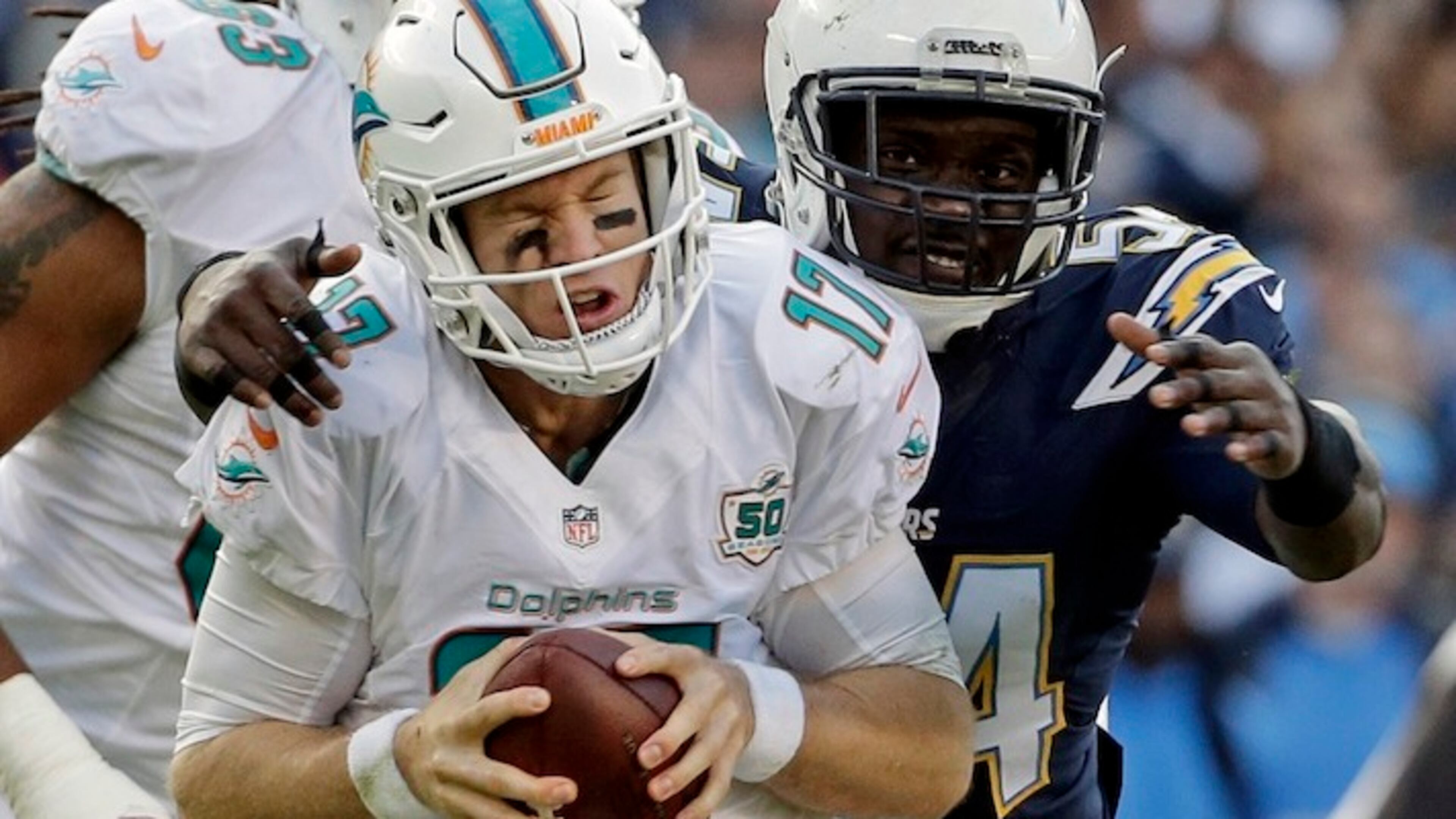 Miami Dolphins quarterback Ryan Tannehill (17) is sacked by San Diego Chargers outside linebacker Melvin Ingram, right, during the second half in an NFL football game Sunday, Dec. 20, 2015, in San Diego. (AP Photo/Gregory Bull)