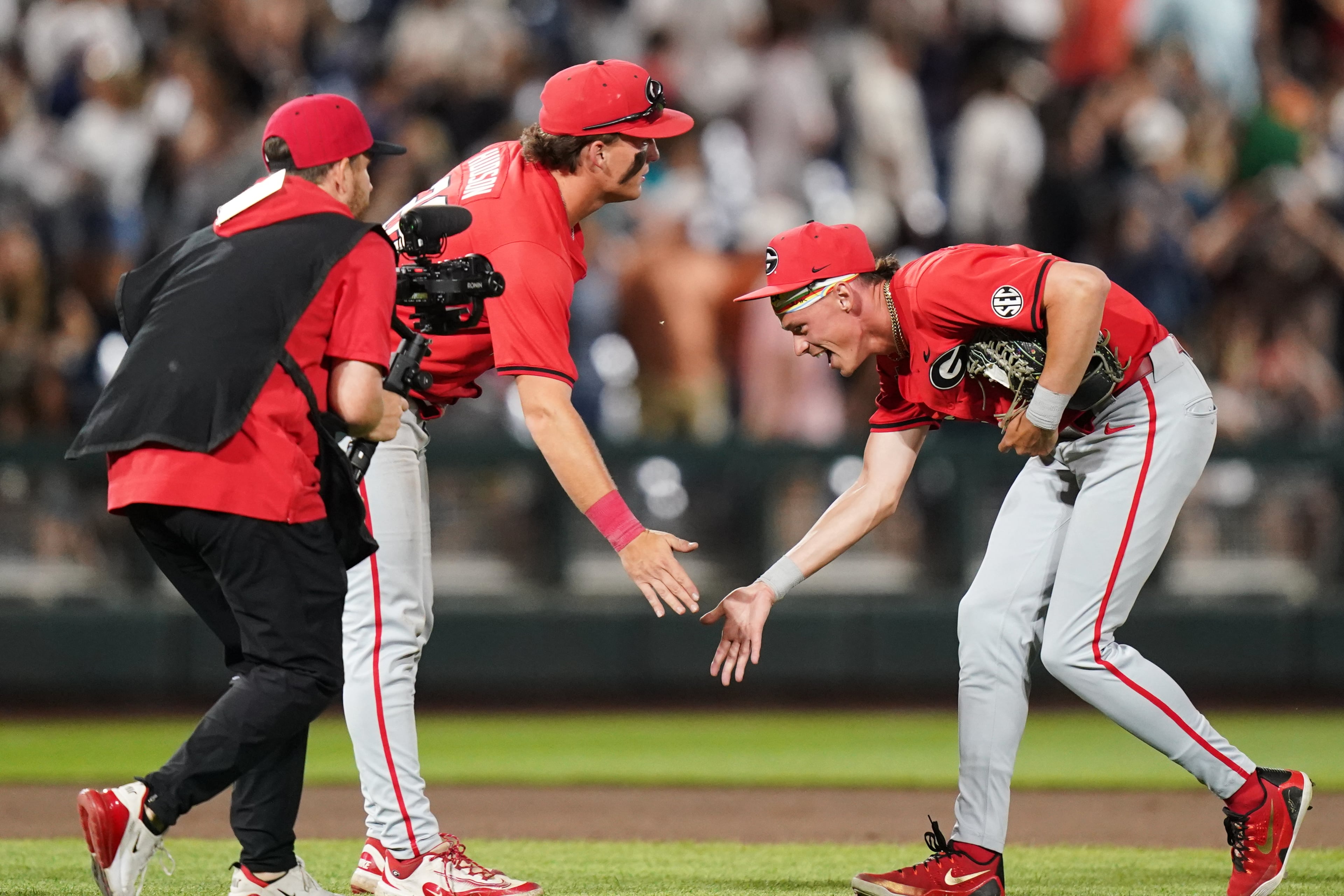 Georgia teammates celebrate after an NCAA baseball College World Series elimination game against Texas, Tuesday, June 16, 2026 in Omaha, Neb. Georgia won 2-0. (AP Photo/Vera Nieuwenhuis)