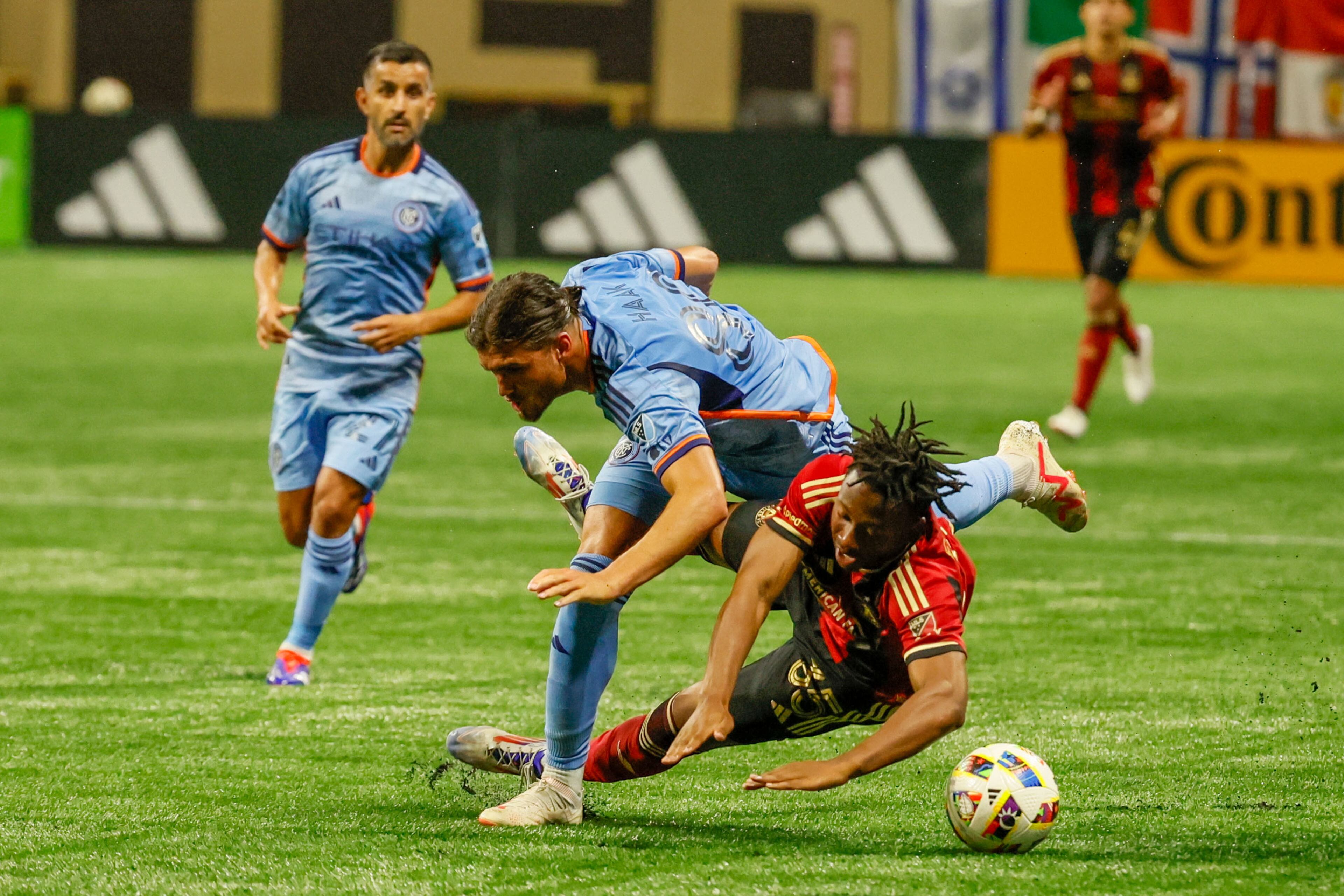 Atlanta United midfielder Ajani Fortune (35) takes a foul from New York City midfielder Justin Haak (80) during the second half against New York City at Mercedes-Benz Stadium on Wednesday, July 17, 2024.
(Miguel Martinez/ AJC)