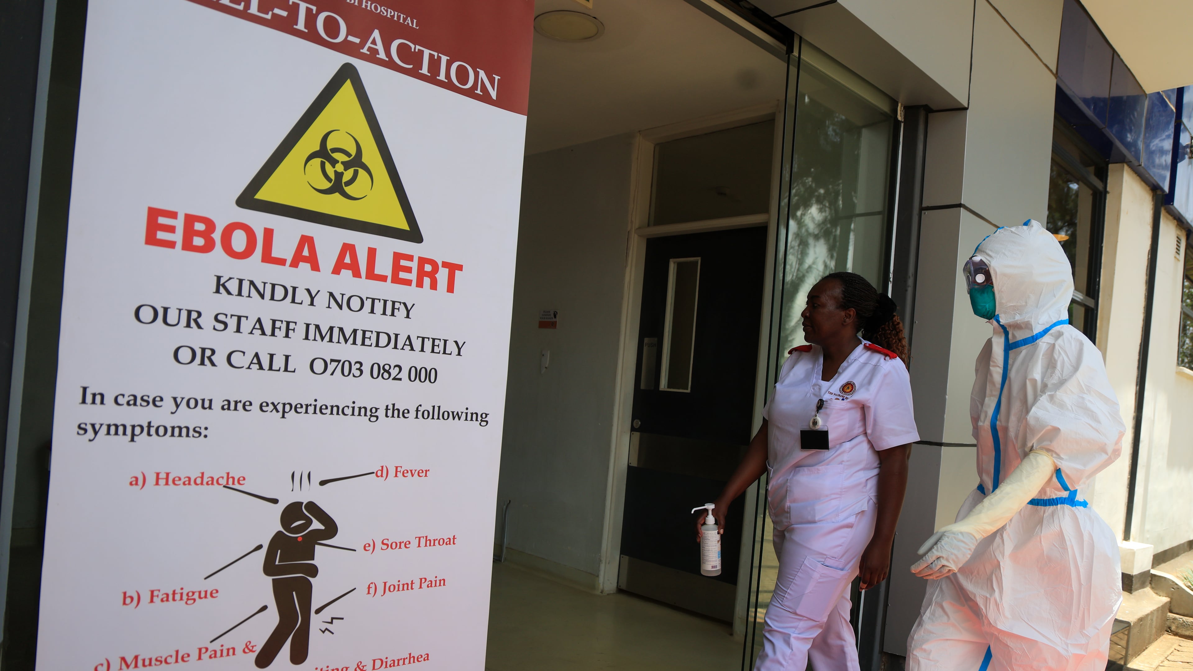 Health workers and officials walk outside a Ebola isolation facility at The Nairobi Hospital, Kenya, Wednesday, Oct. 7, 2026. (AP Photo/Andrew Kasuku)
