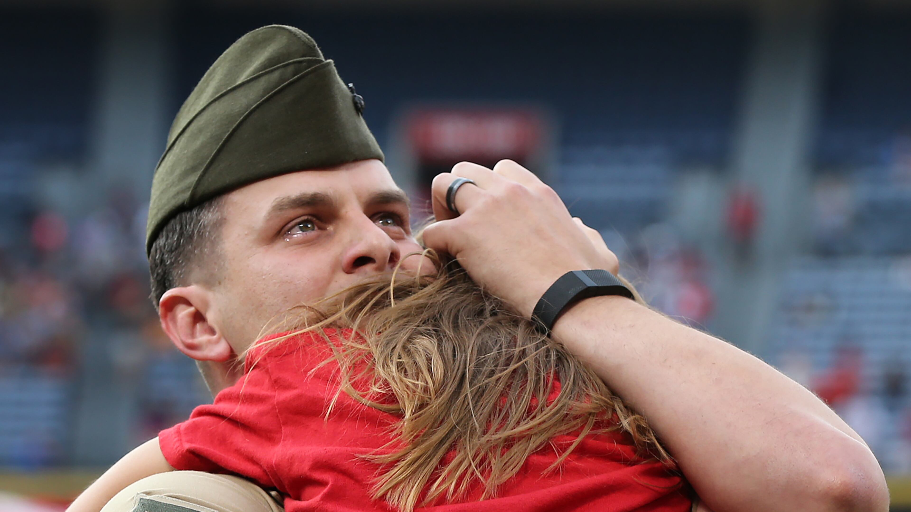 051116 ATLANTA: U.S. Marine Corps SSG Clayton Walker is moved to tears as he is reunited with his daughter Cassidy, 10, Langston Elementary School, Perry, GA, after his fifth tour of duty just before the first pitch in the Braves and Phillies baseball game at Turner Field on Wednesday, May 11, 2016, in Atlanta. Curtis Compton / ccompton@ajc.com