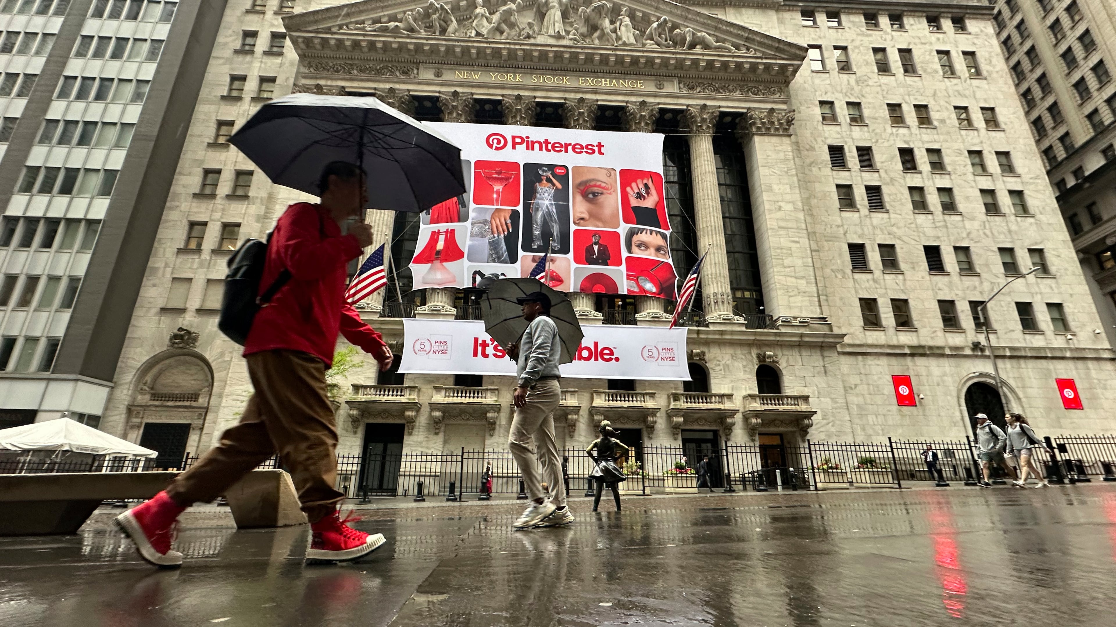 FILE - Banners for Pinterest, displayed to mark the fifth anniversary of the company's listing, hang on the front of the New York Stock Exchange in New York, May 15, 2024. (AP Photo/Peter Morgan, File)