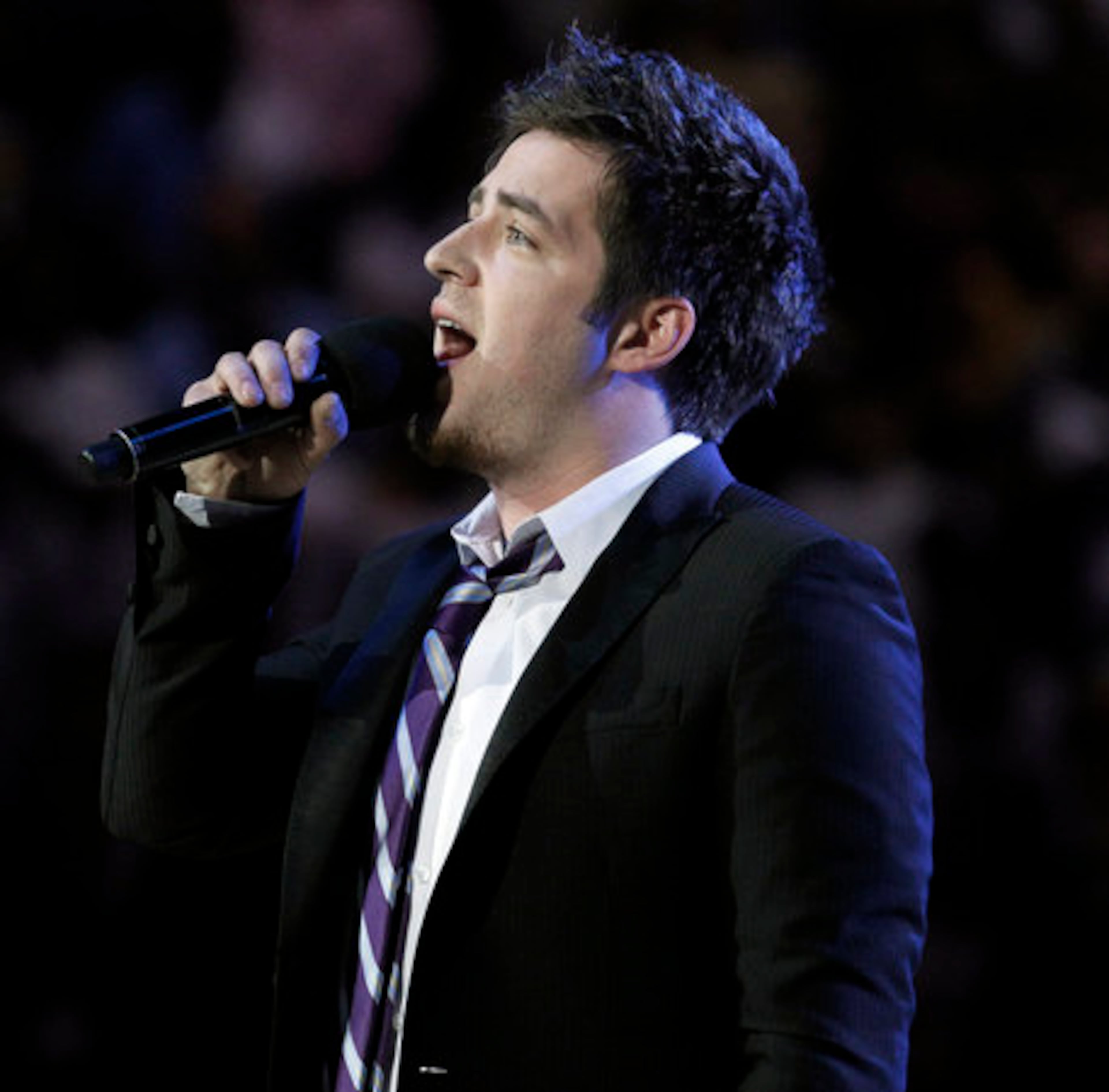 "American Idol" winner Lee DeWyze sings the national anthem before Game 2 of the NBA basketball finals between the Los Angeles Lakers and the Boston Celtics on Sunday, June 6, 2010, in Los Angeles.
